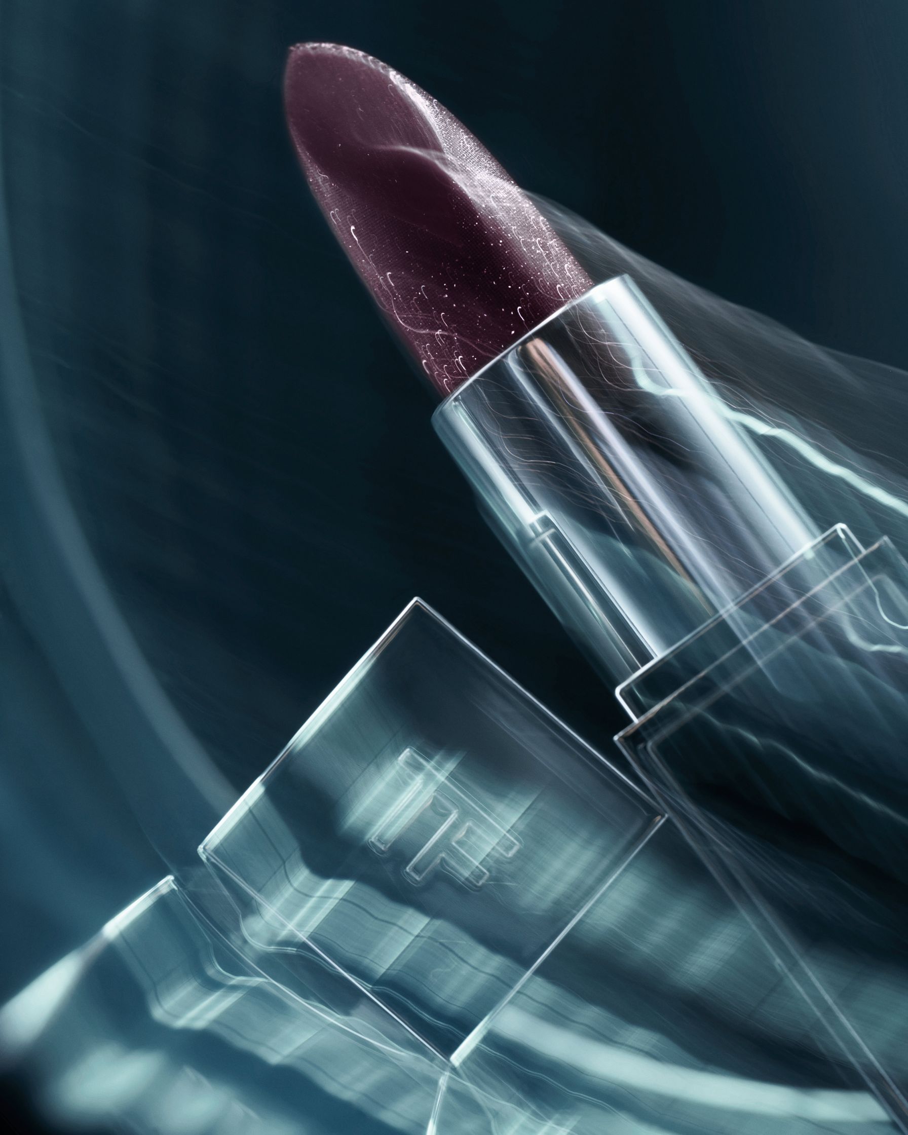 Close-up of a Tom Ford lipstick, creatively photographed with blurred light effects to evoke a sense of motion, resembling a futuristic spacecraft in flight.
