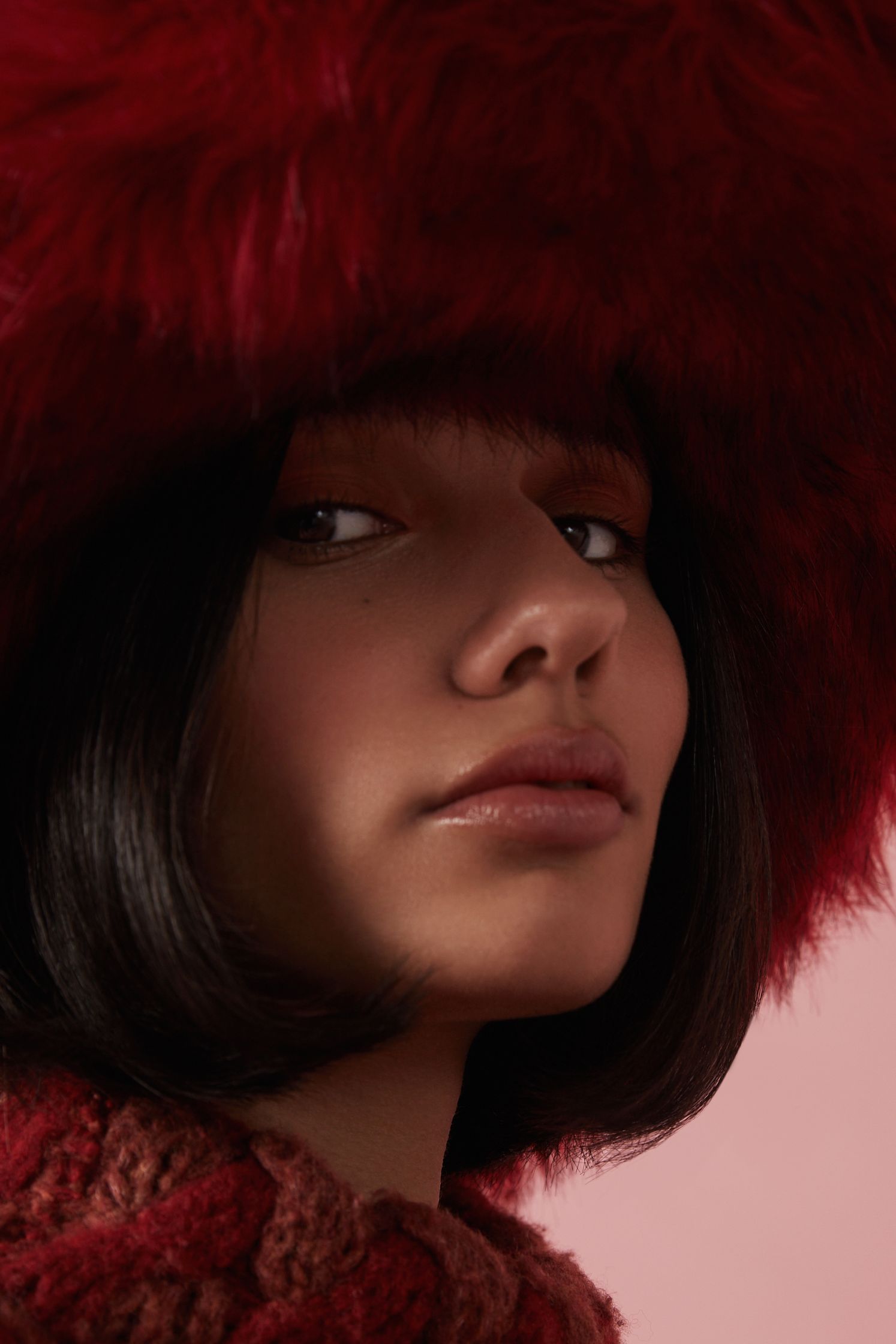 a woman wearing a red hat and scarf