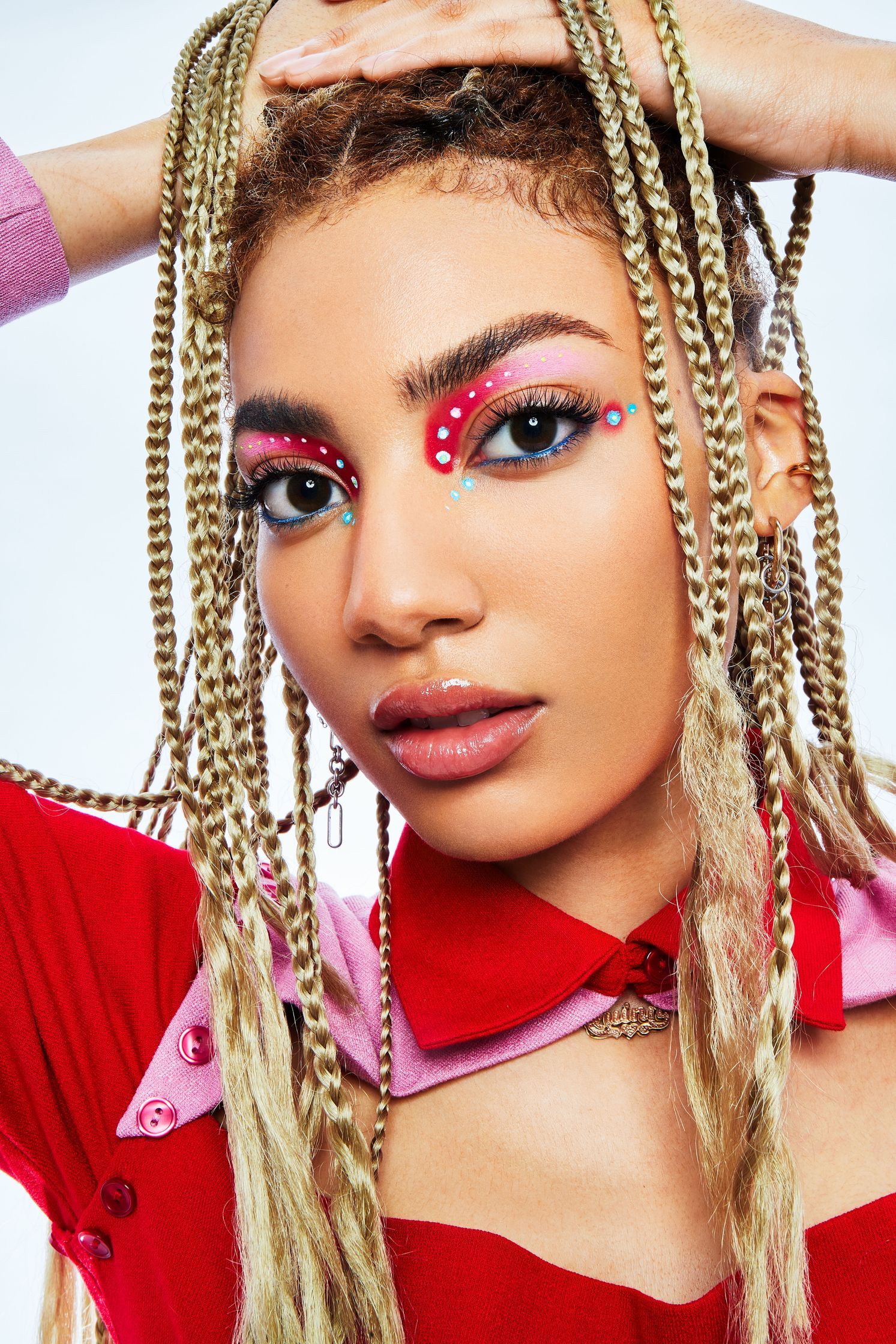 a woman with dreadlocks posing for a photo