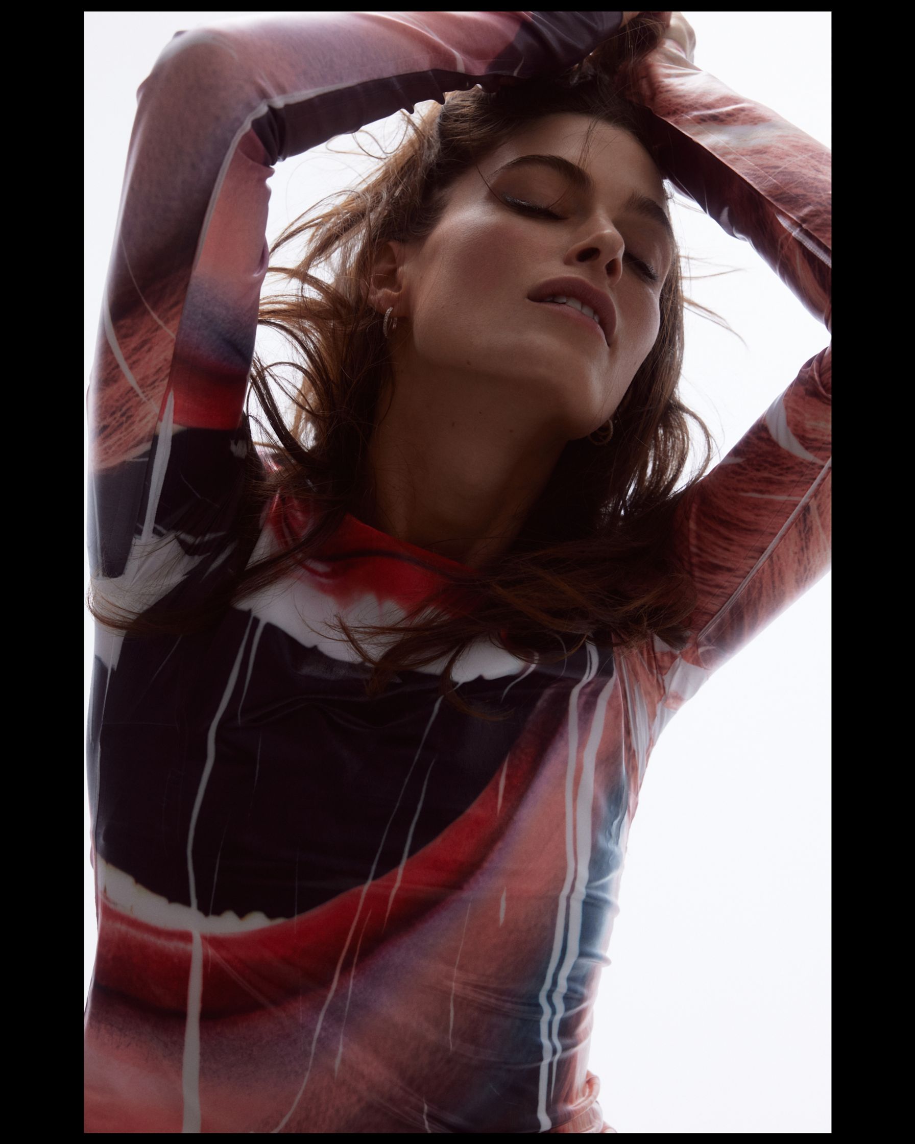 a woman wearing a long - sleeved shirt