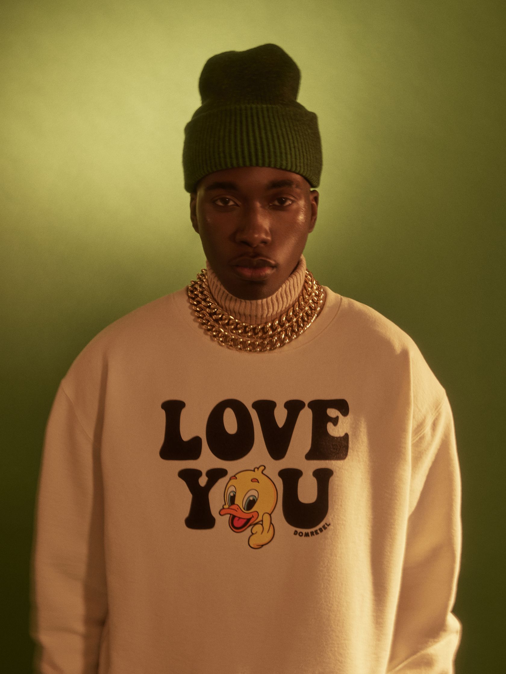 a black man wearing a sweatshirt that says love you