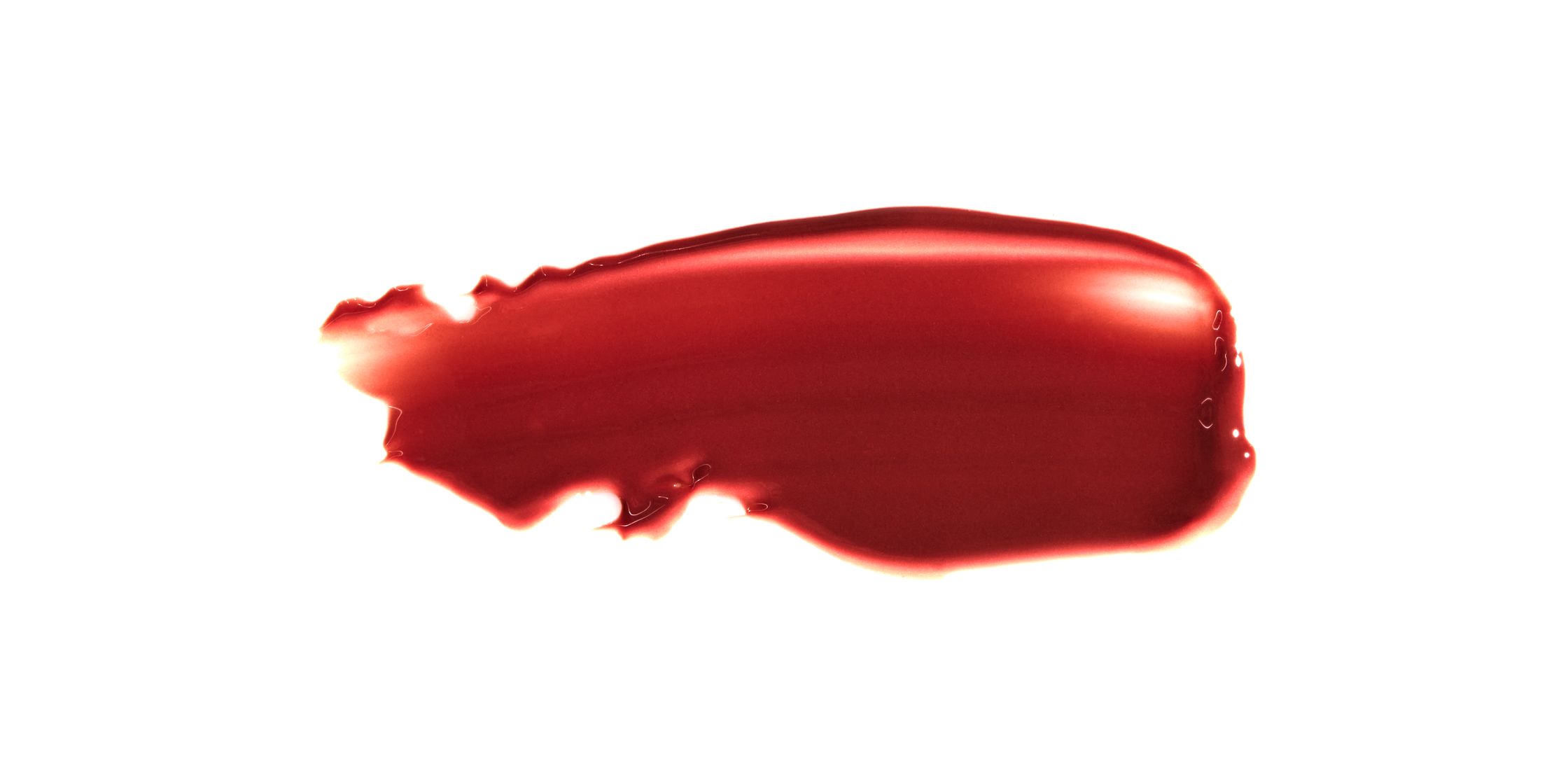 a red liquid lipstick on a white background