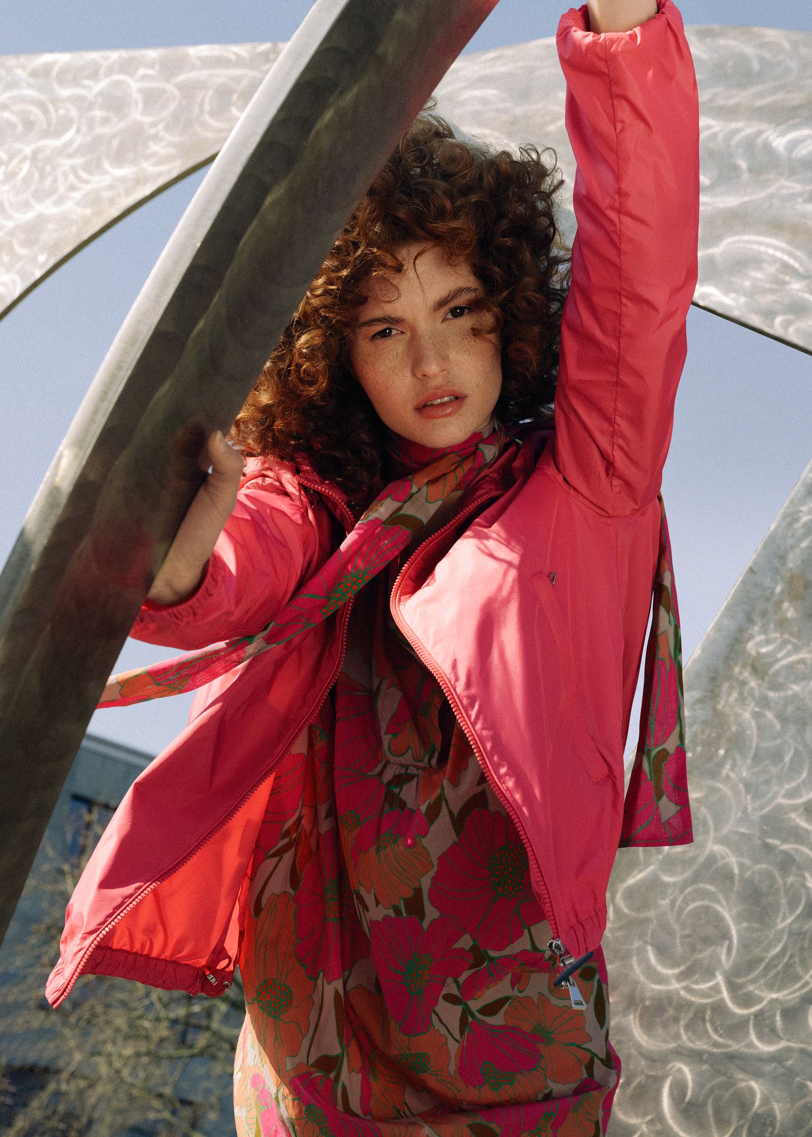 a woman wearing a pink jacket