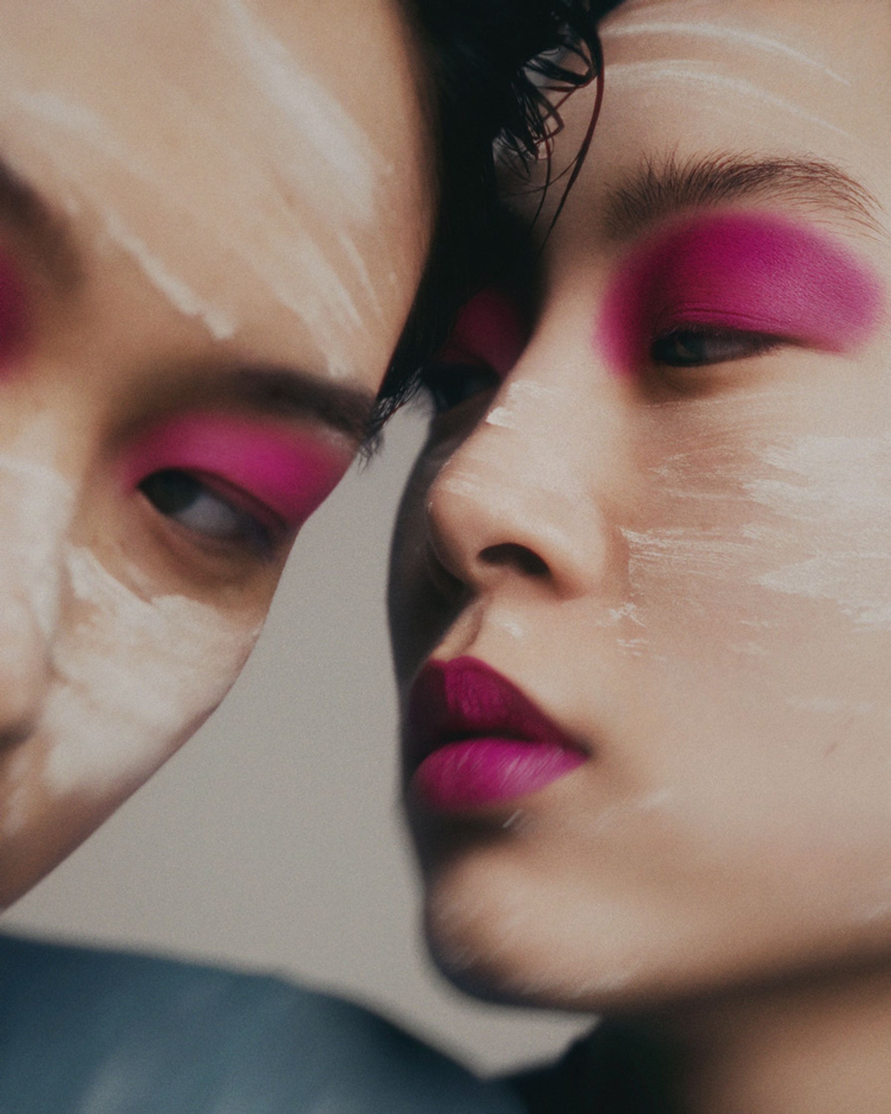 two asian women with pink makeup on their faces