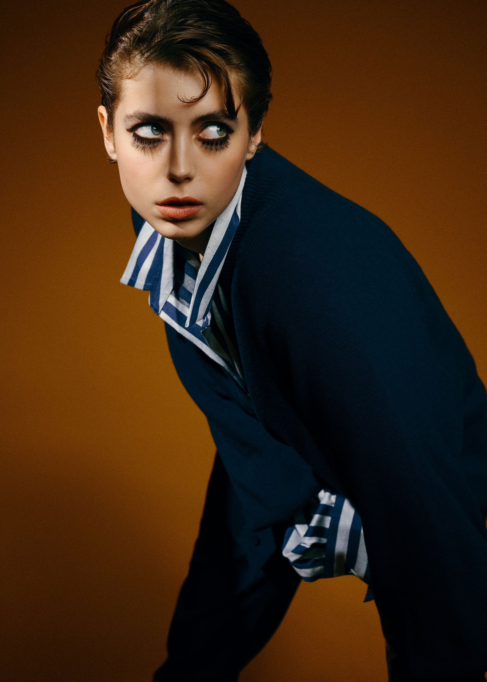 a woman is posing for a magazine