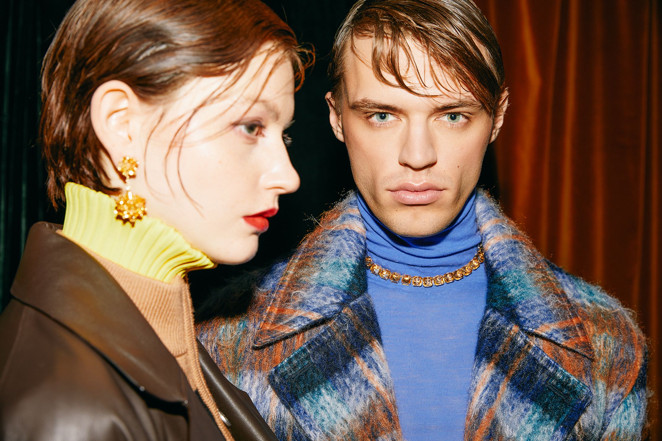 a woman and a man in a blue coat