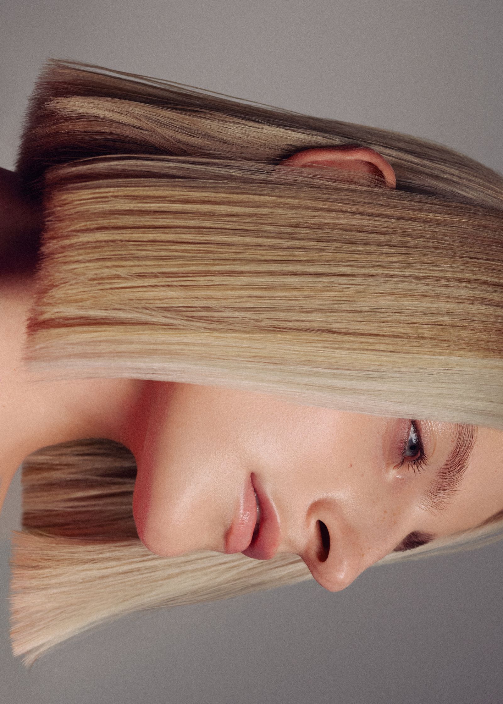 a woman with long blonde hair is posing for a photo