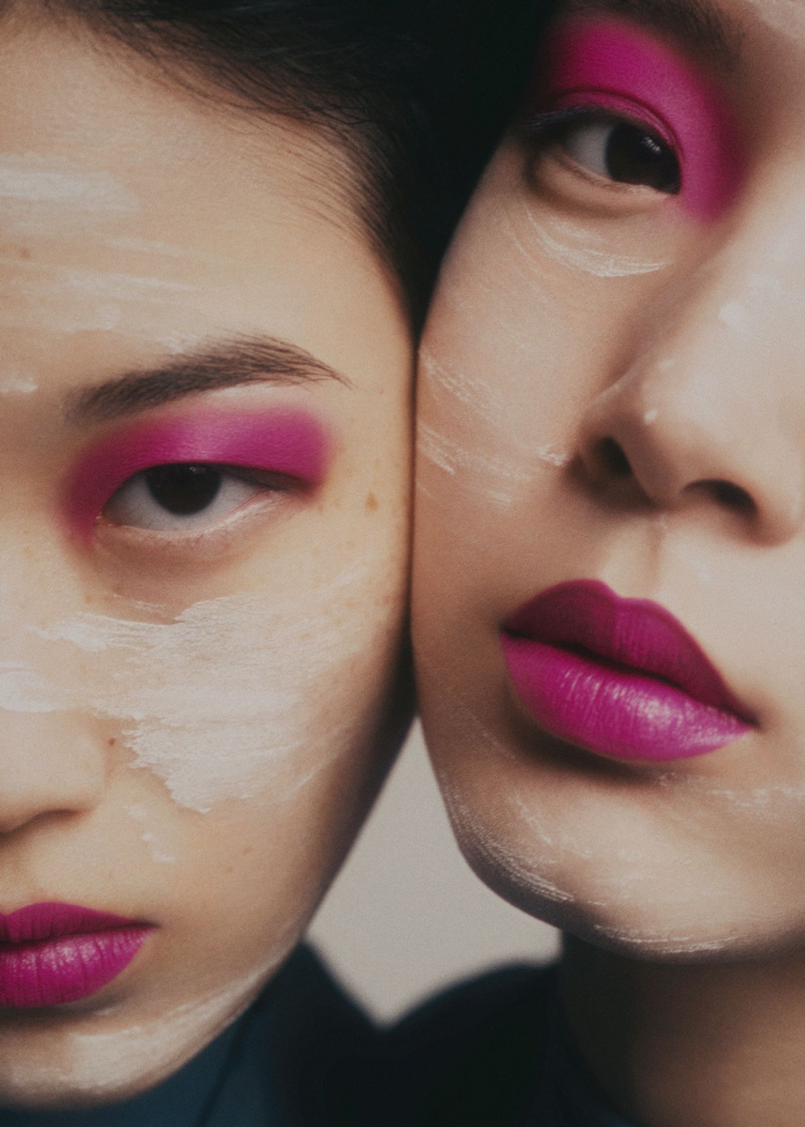 two asian women with pink makeup on their faces