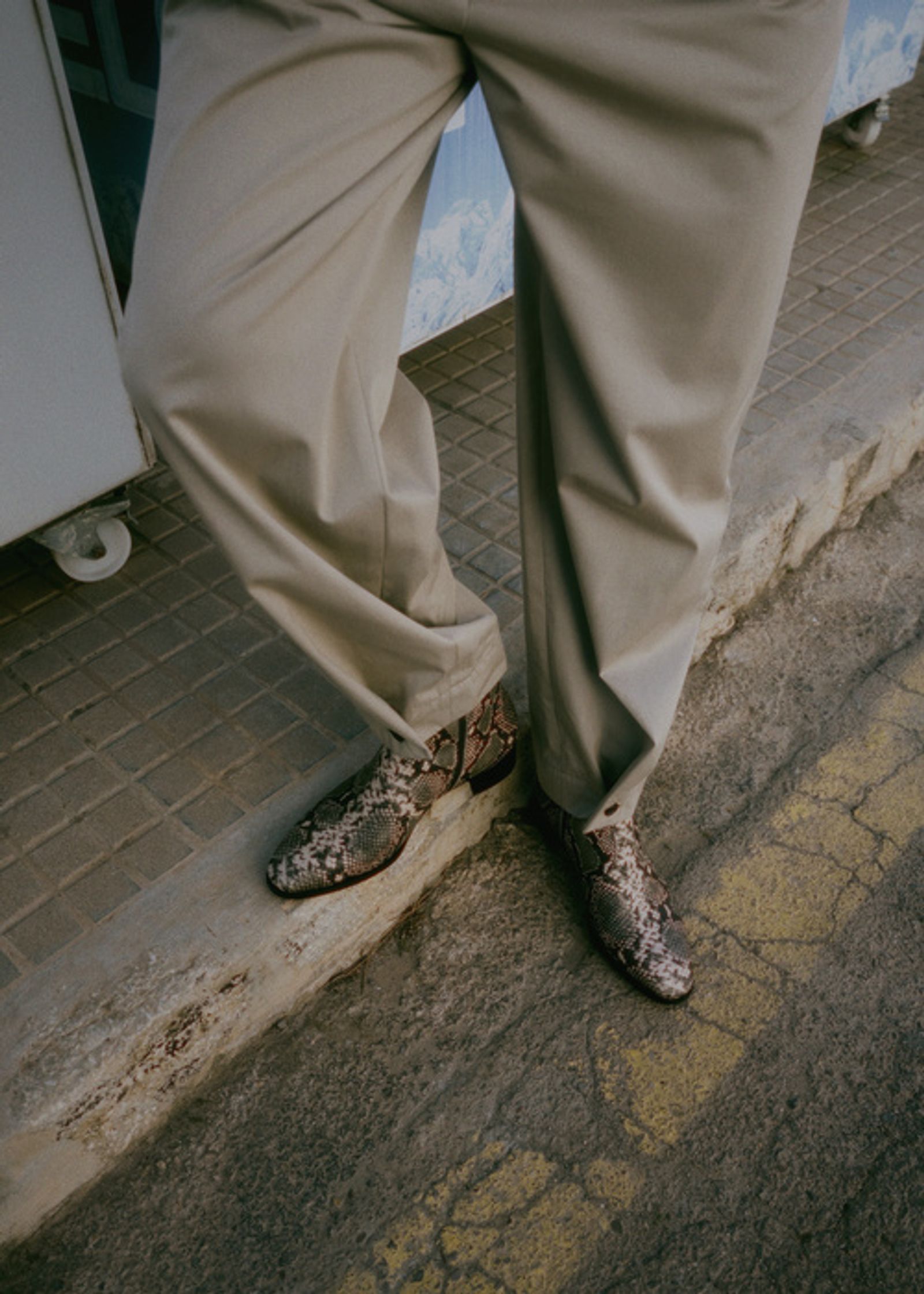 a man wearing a pair of pants and a pair of shoes