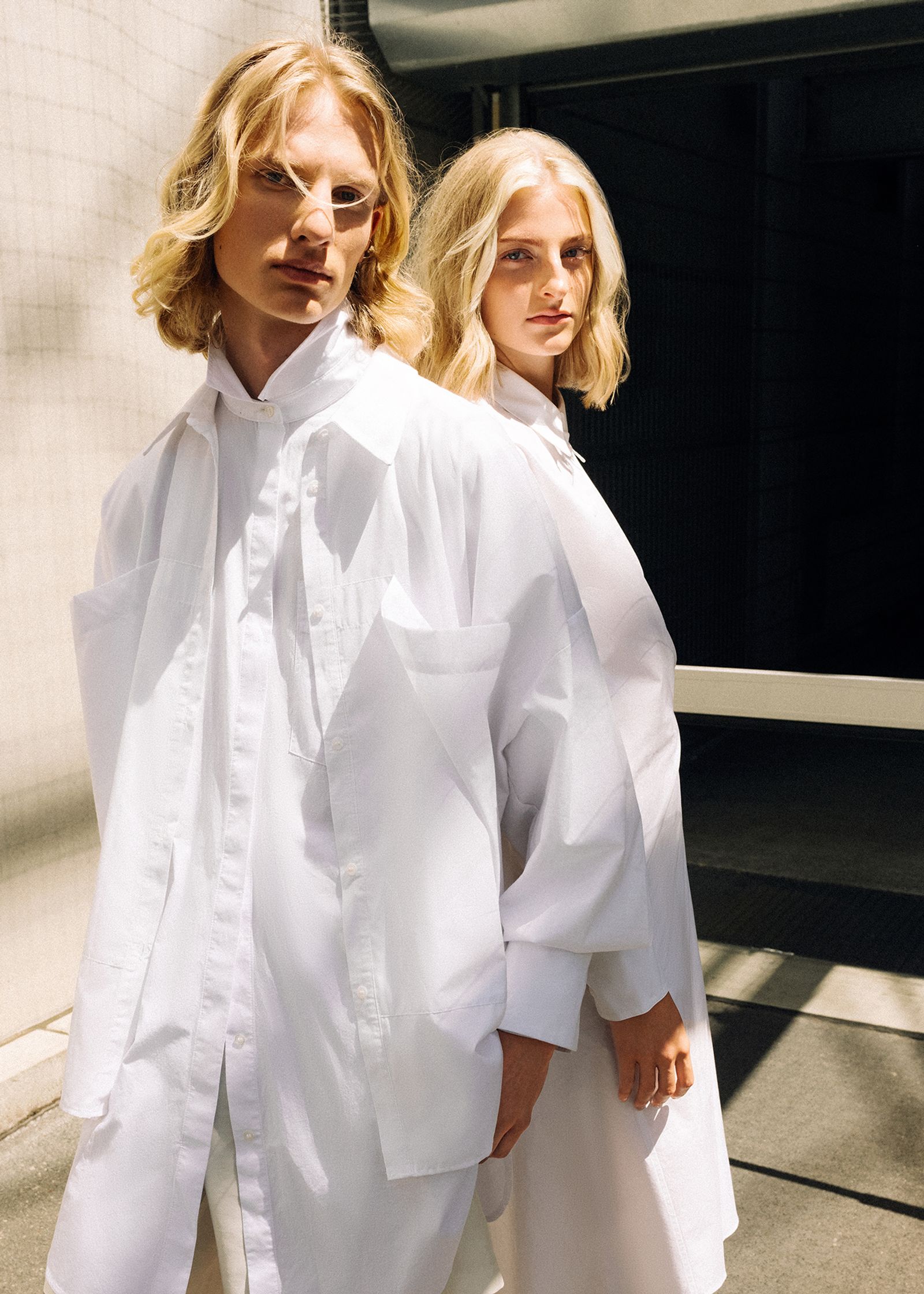 a man and a woman wearing white shirts