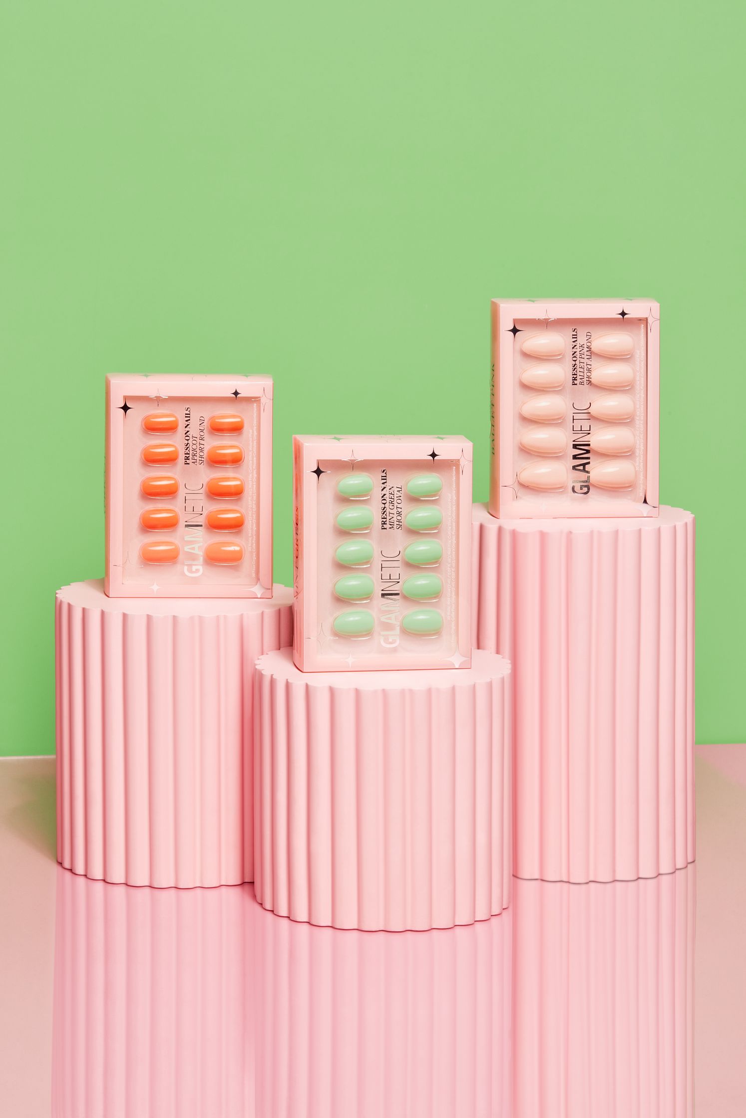 three pink boxes stacked on top of each other