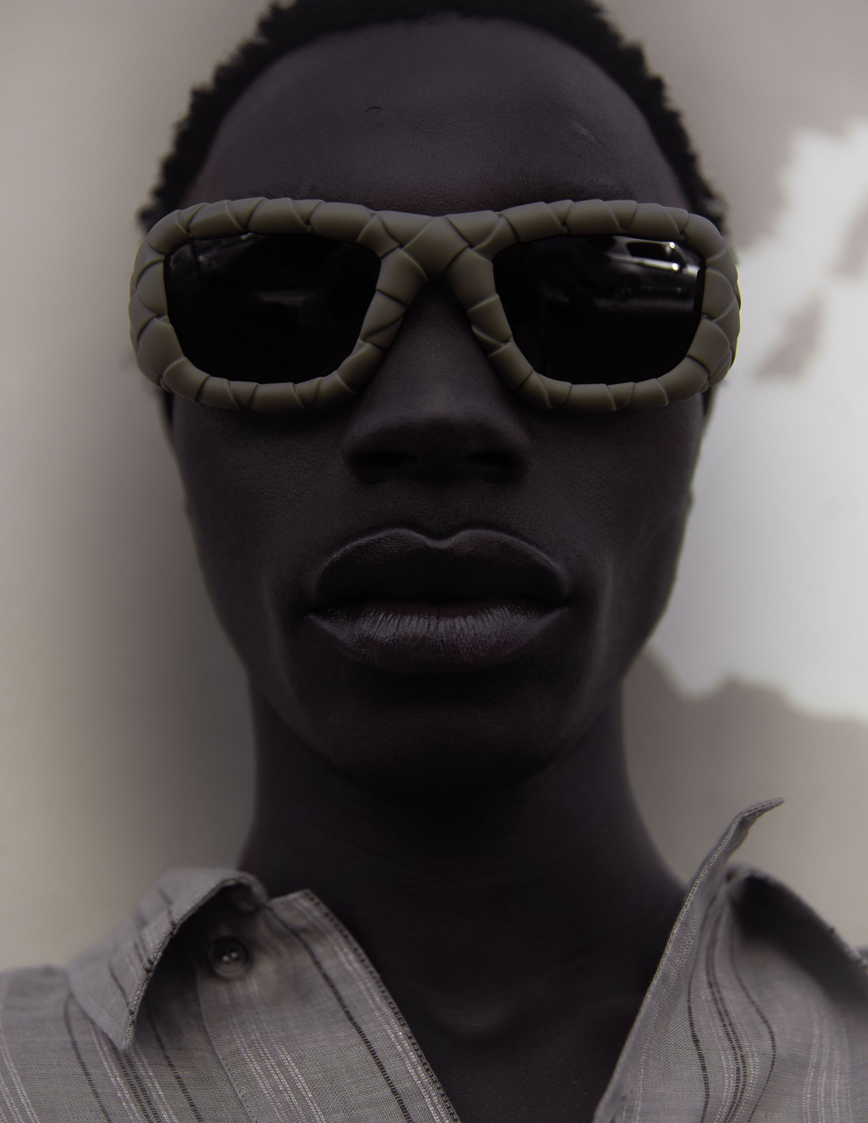 a man wearing sunglasses and a shirt