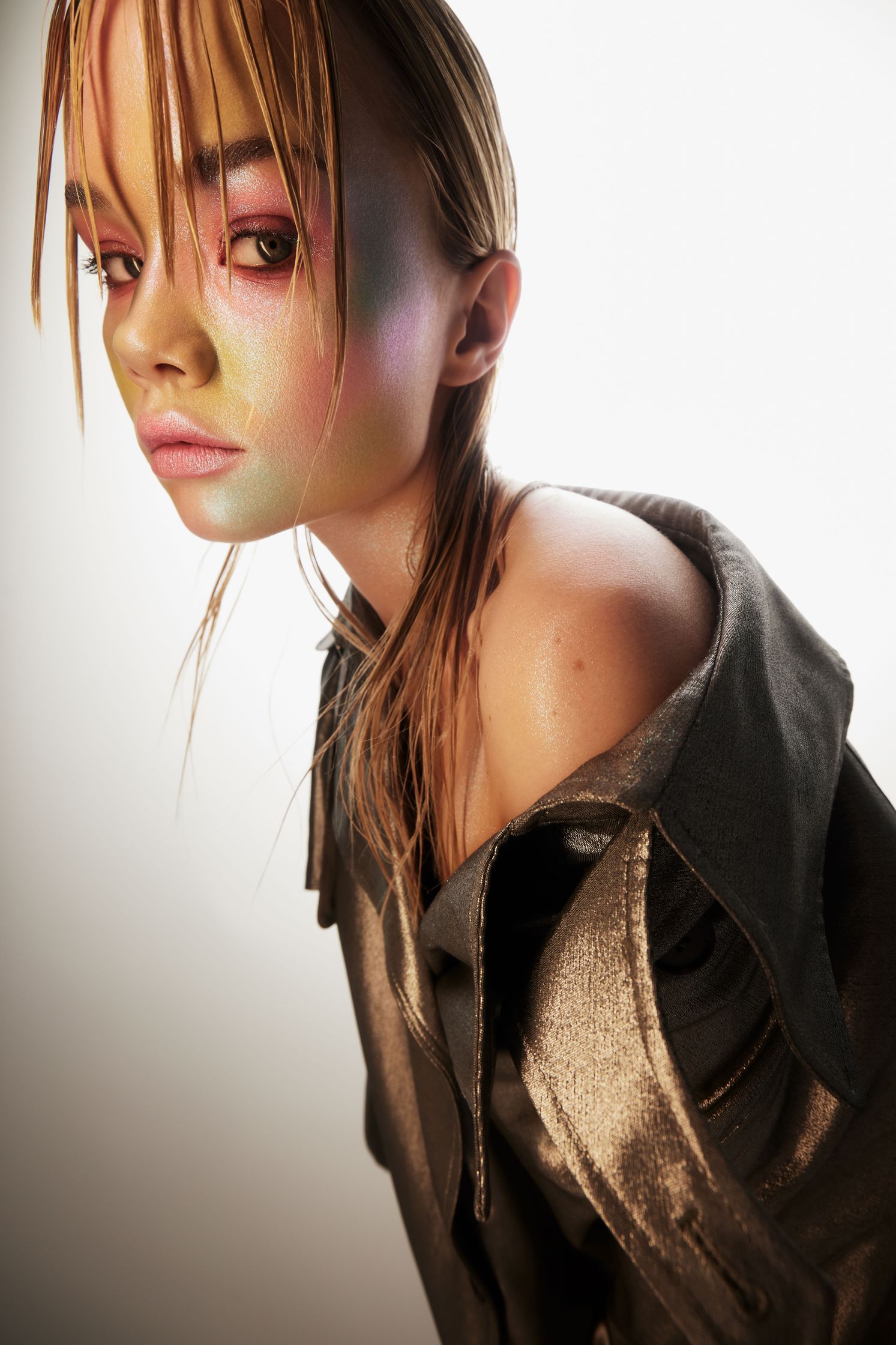 a girl with colorful makeup on her face