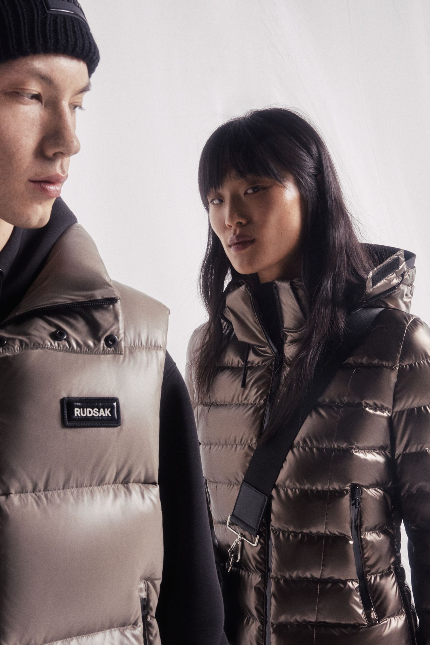 a man and a woman wearing down jackets