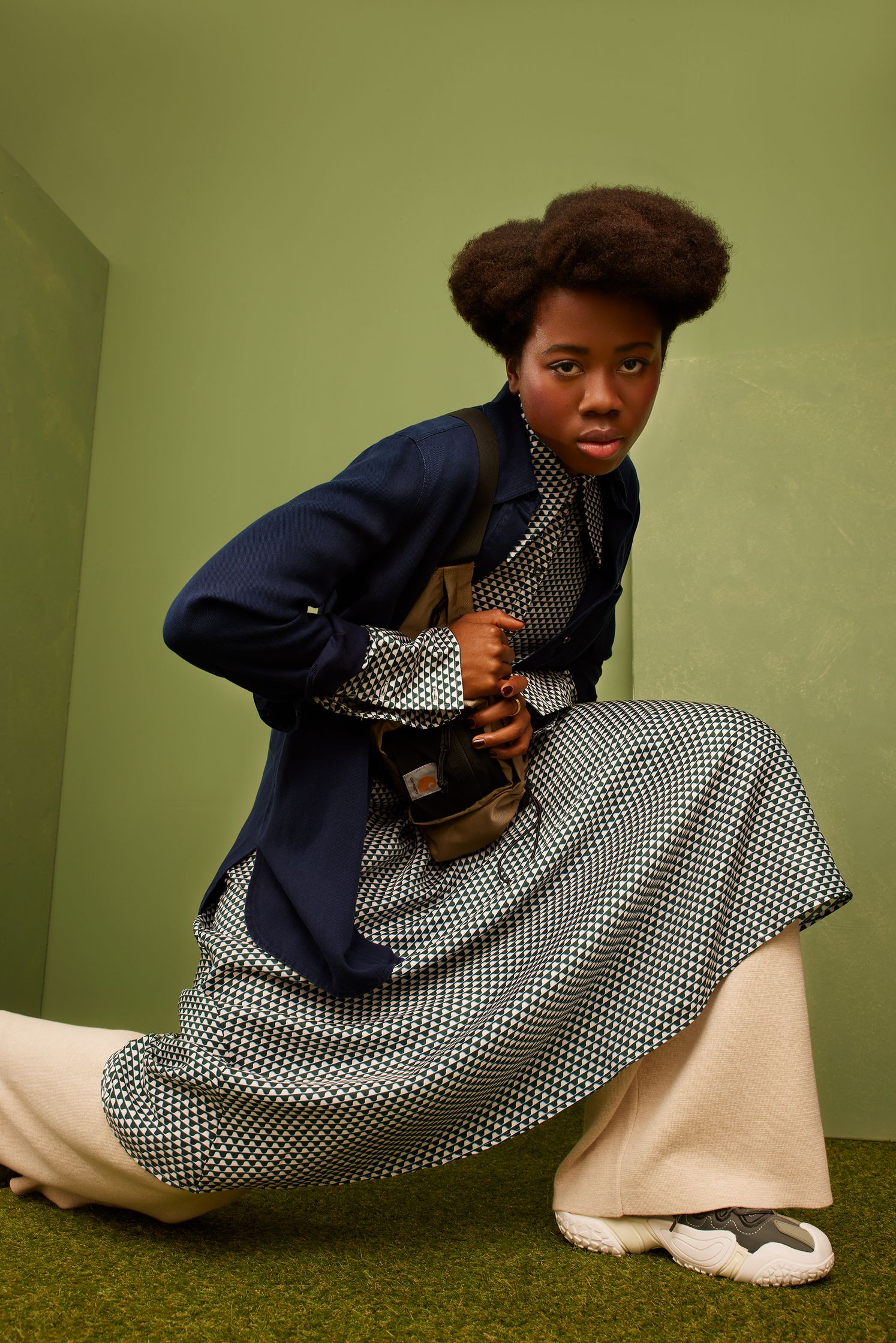 a woman with an afro posing for a magazine
