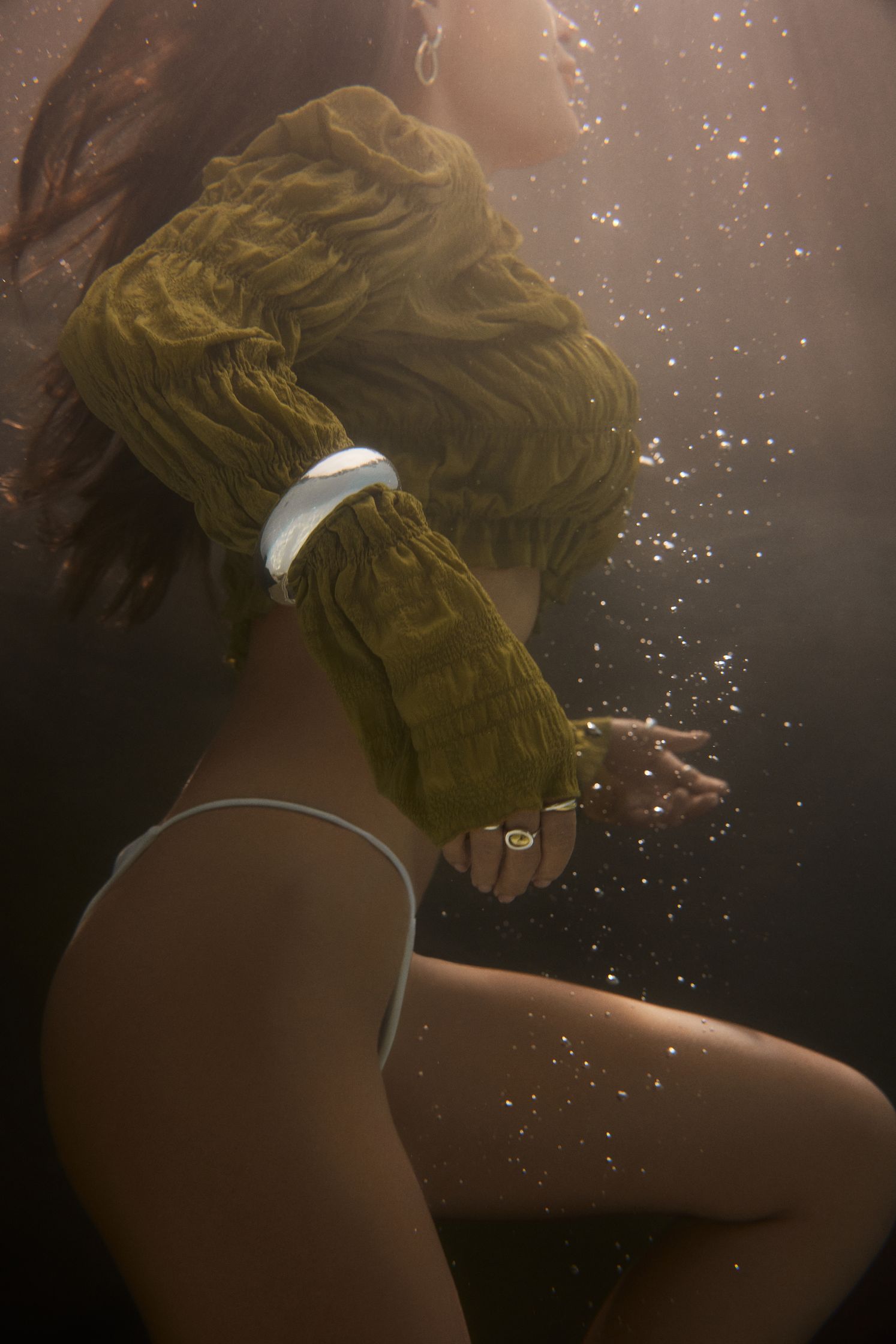 a woman in a bikini under water