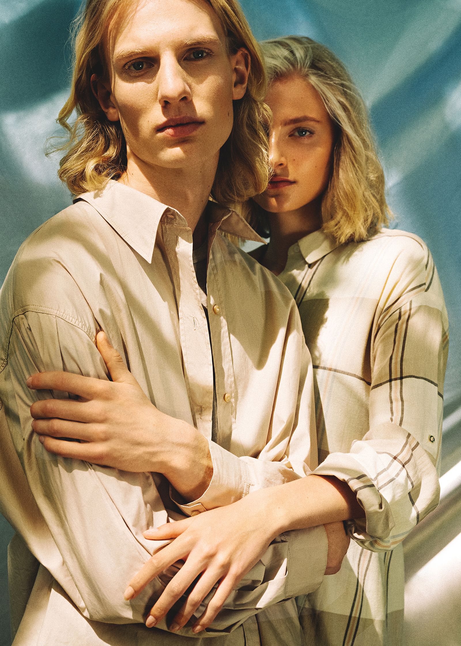 a man and a woman posing for a magazine