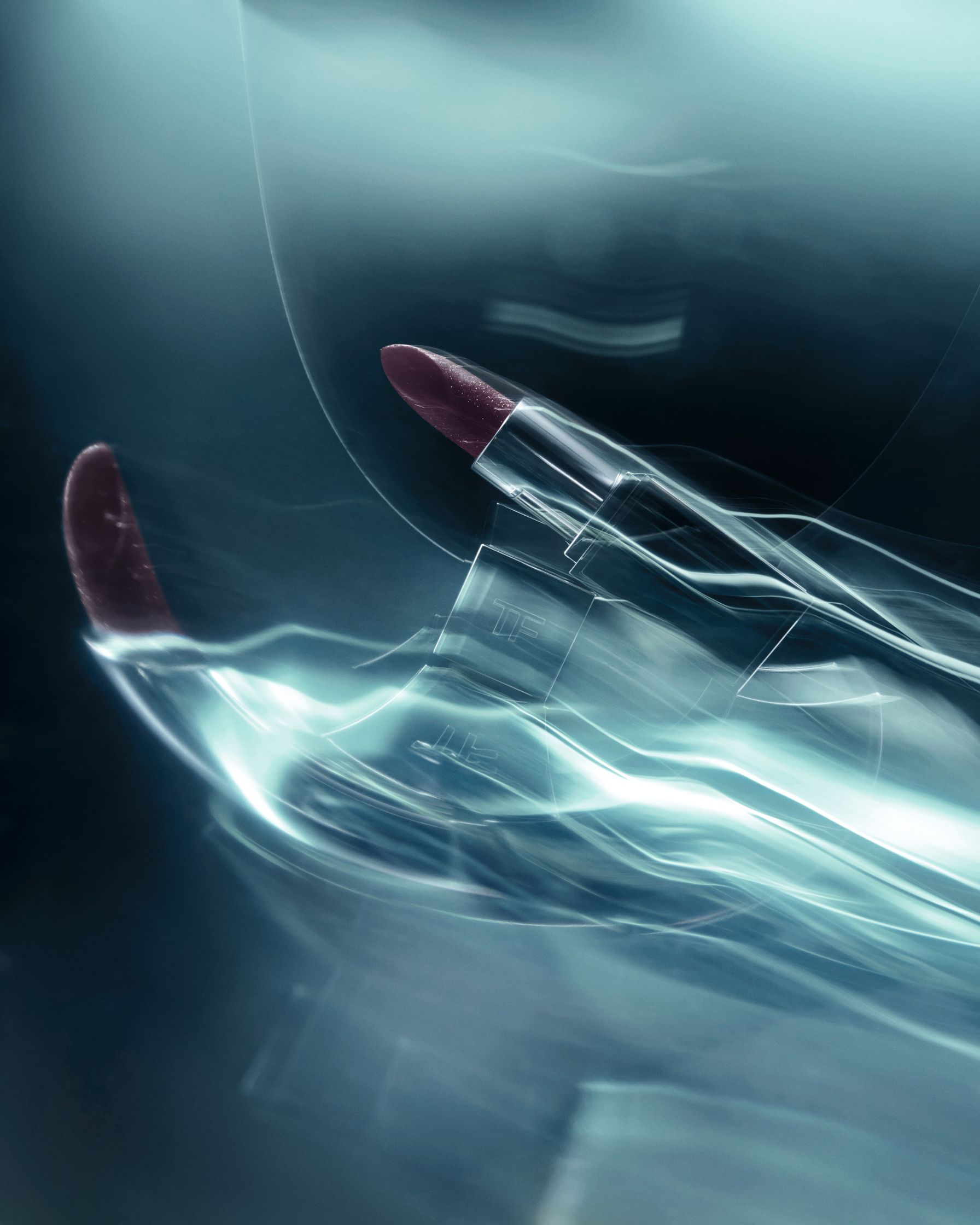 Artistic image of a Tom Ford lipstick, photographed with streaks of light, creating a space-inspired, ethereal atmosphere.