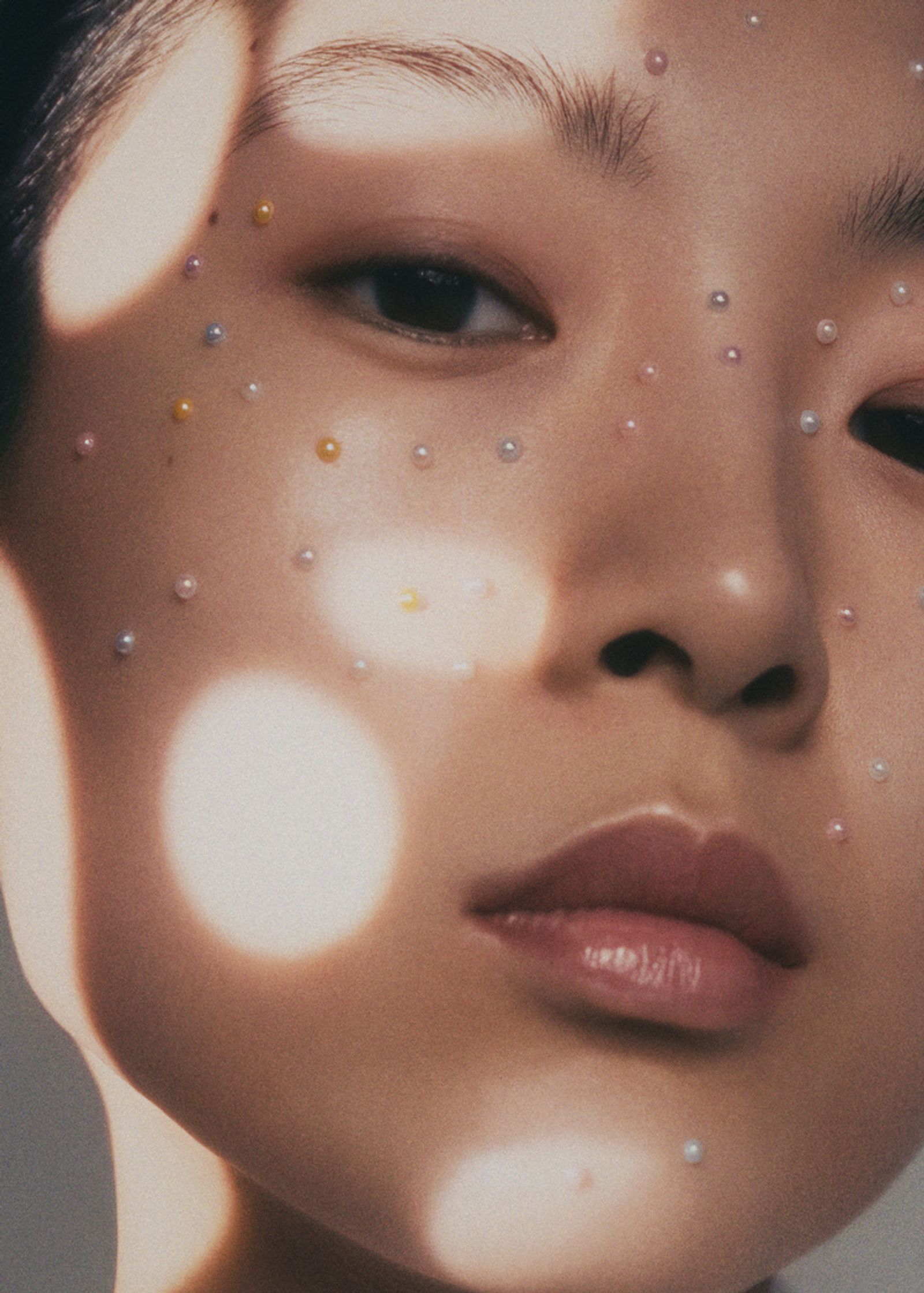 a woman with pearls on her face