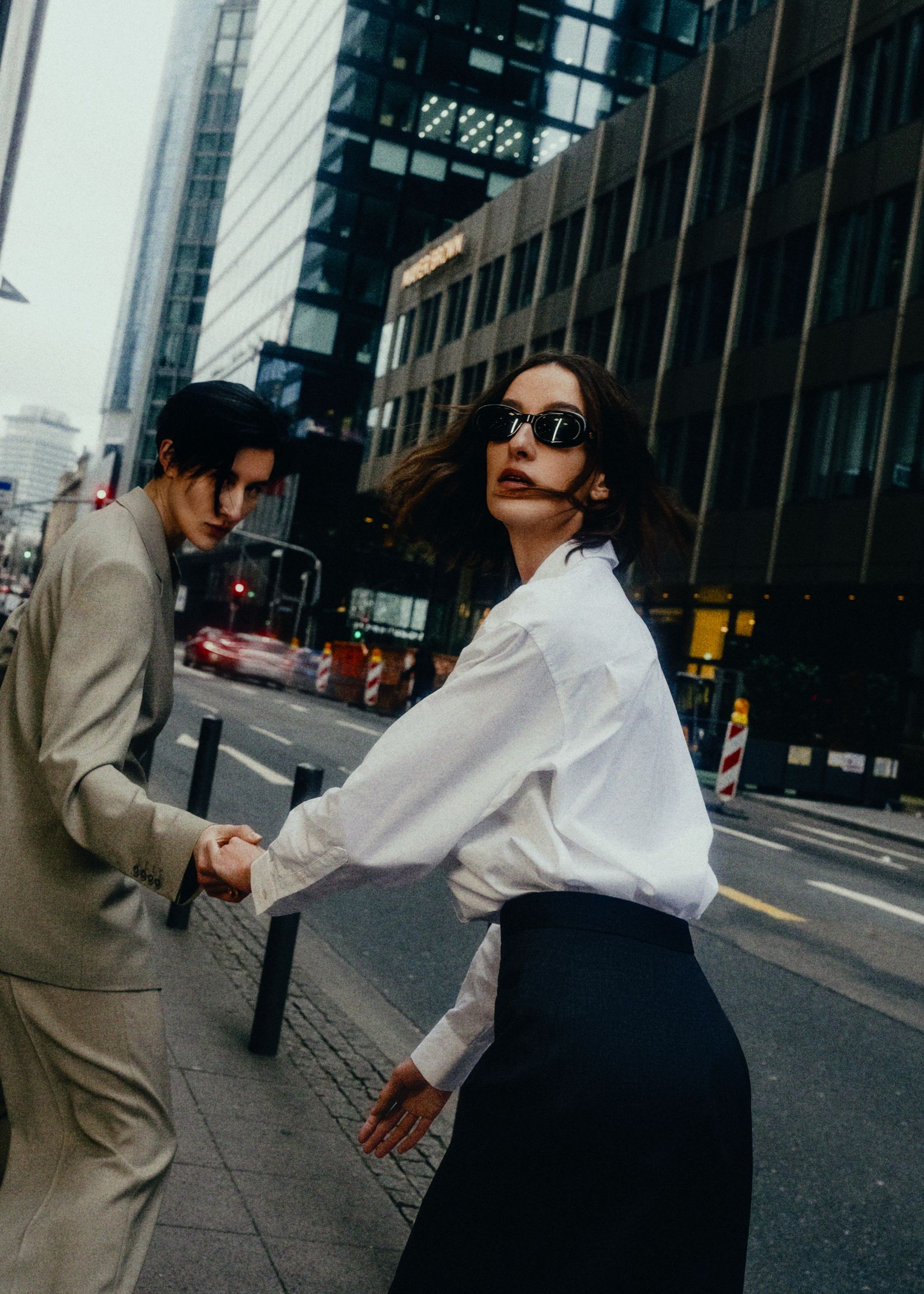 two women standing on a street