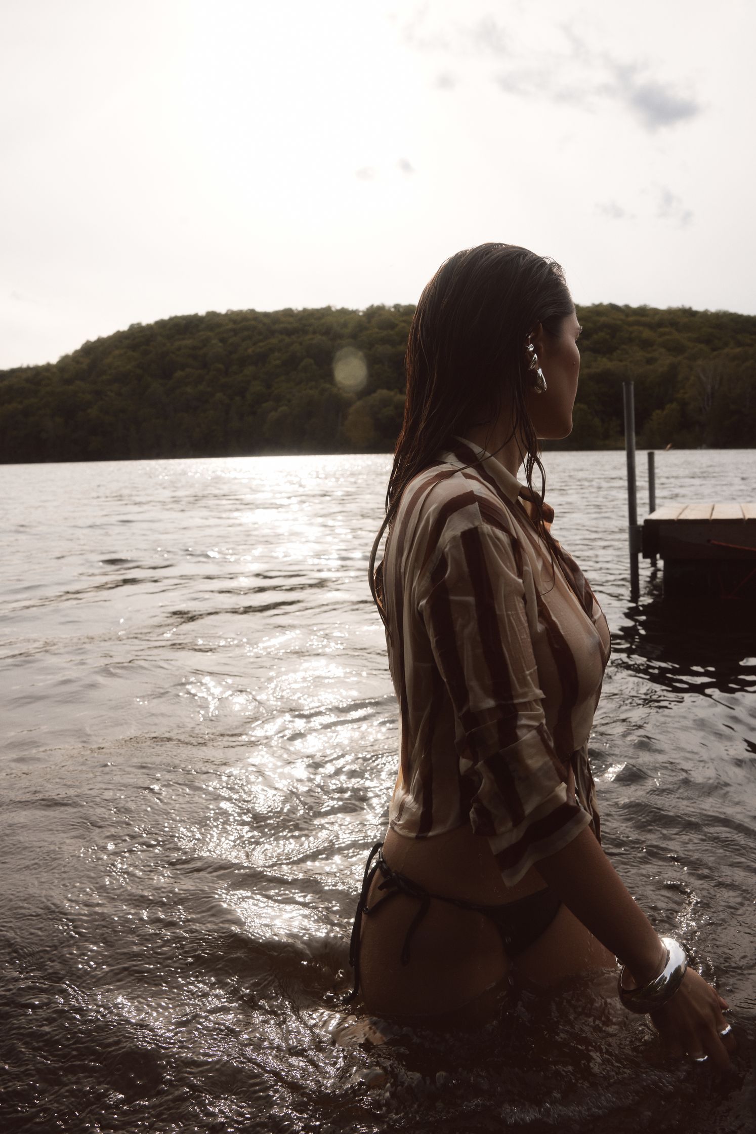 a woman in a bikini standing in the water