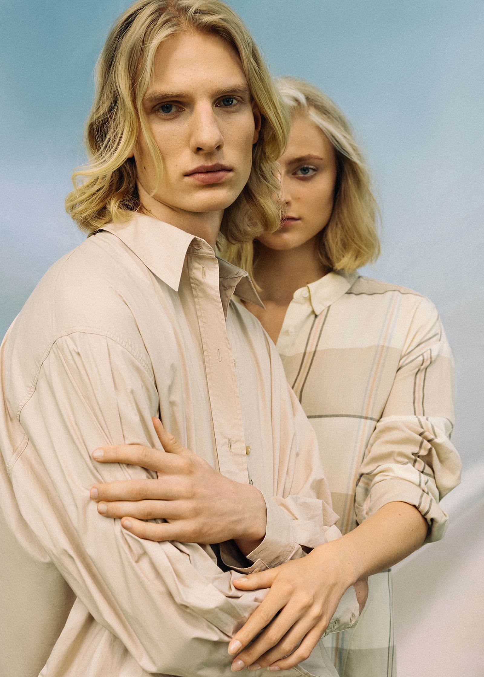 a man and a woman posing for a magazine