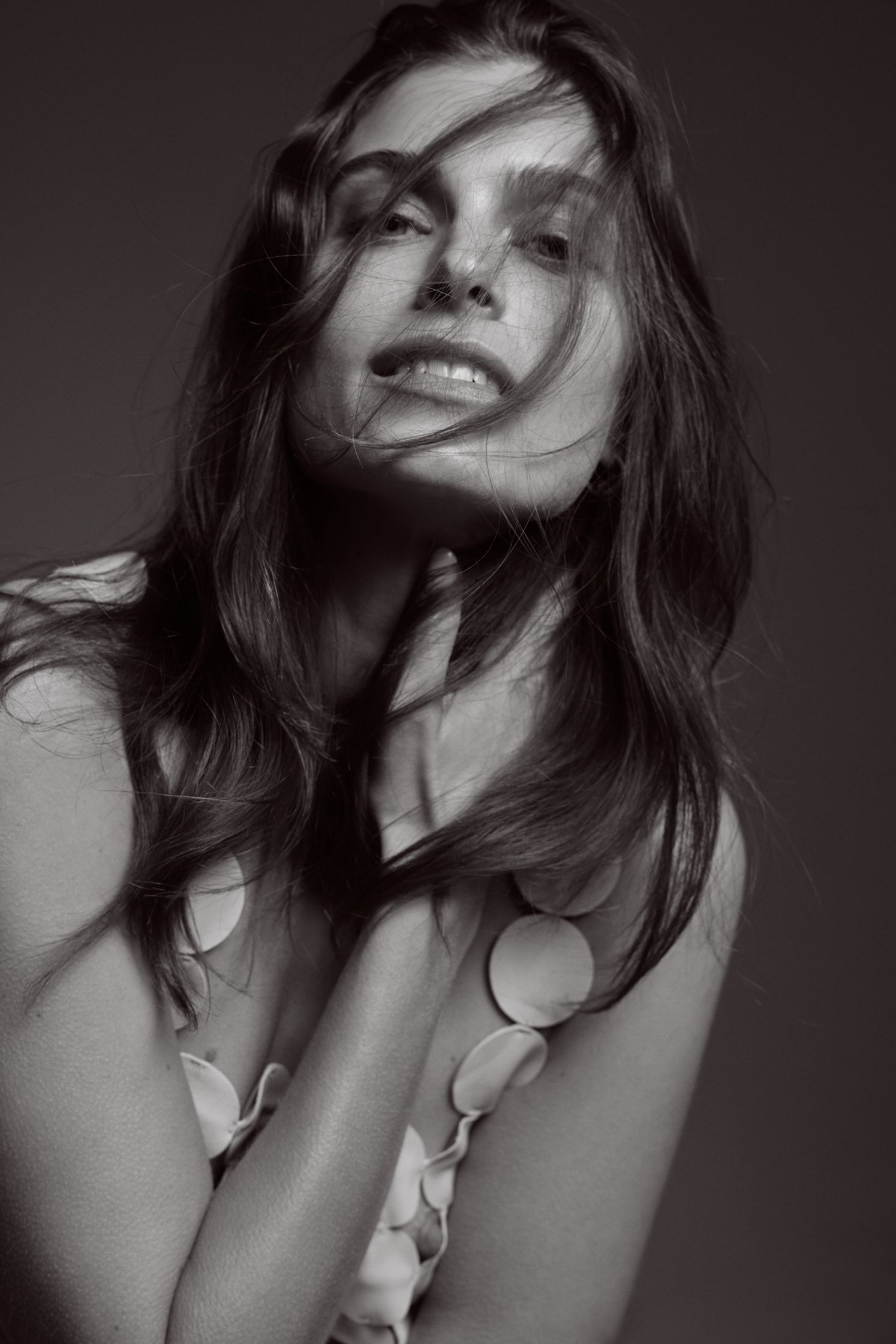 a black and white photo of a woman posing