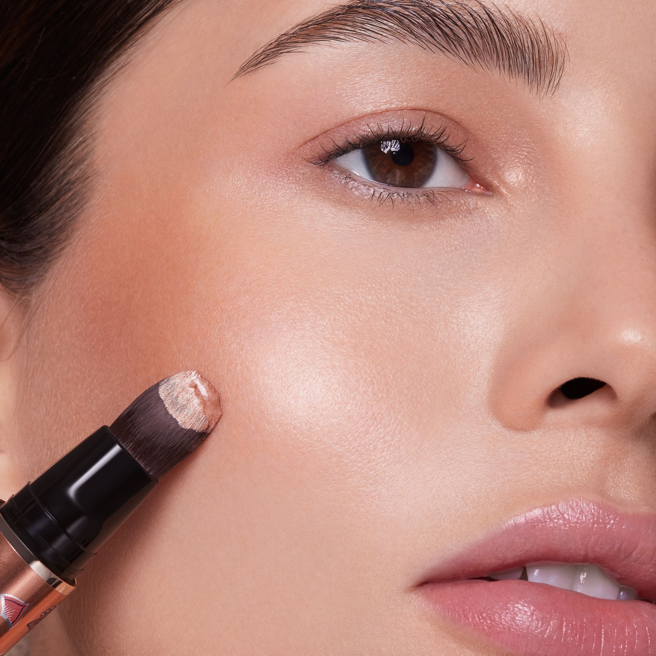 a woman's face with a highlight stick on it