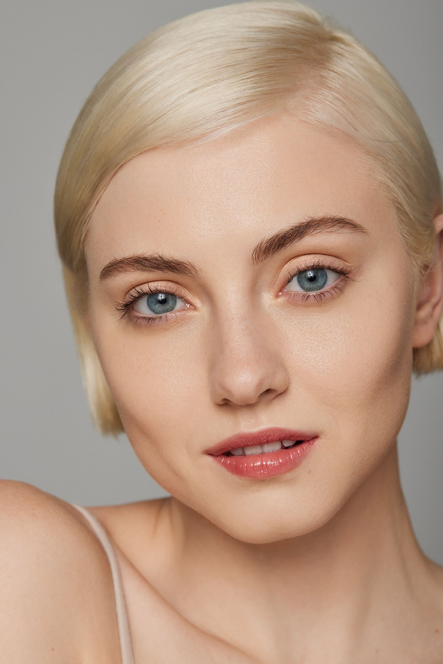 a woman with blond hair and blue eyes