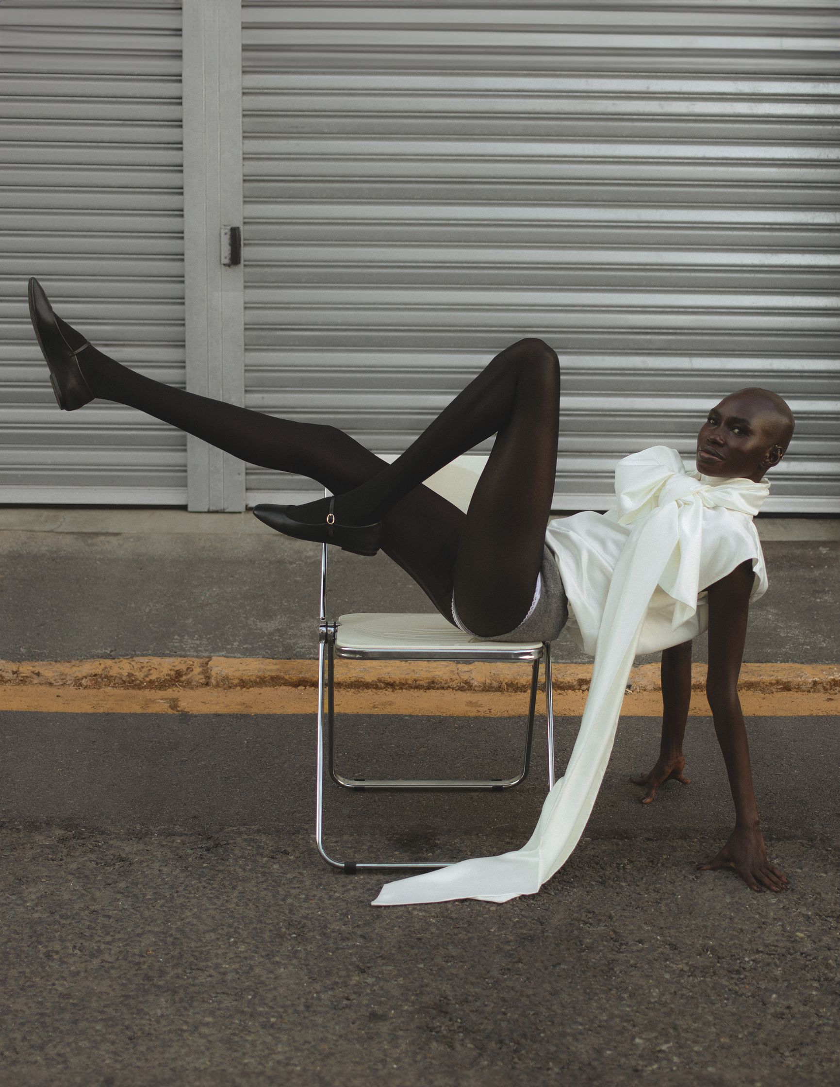 a woman laying on a chair