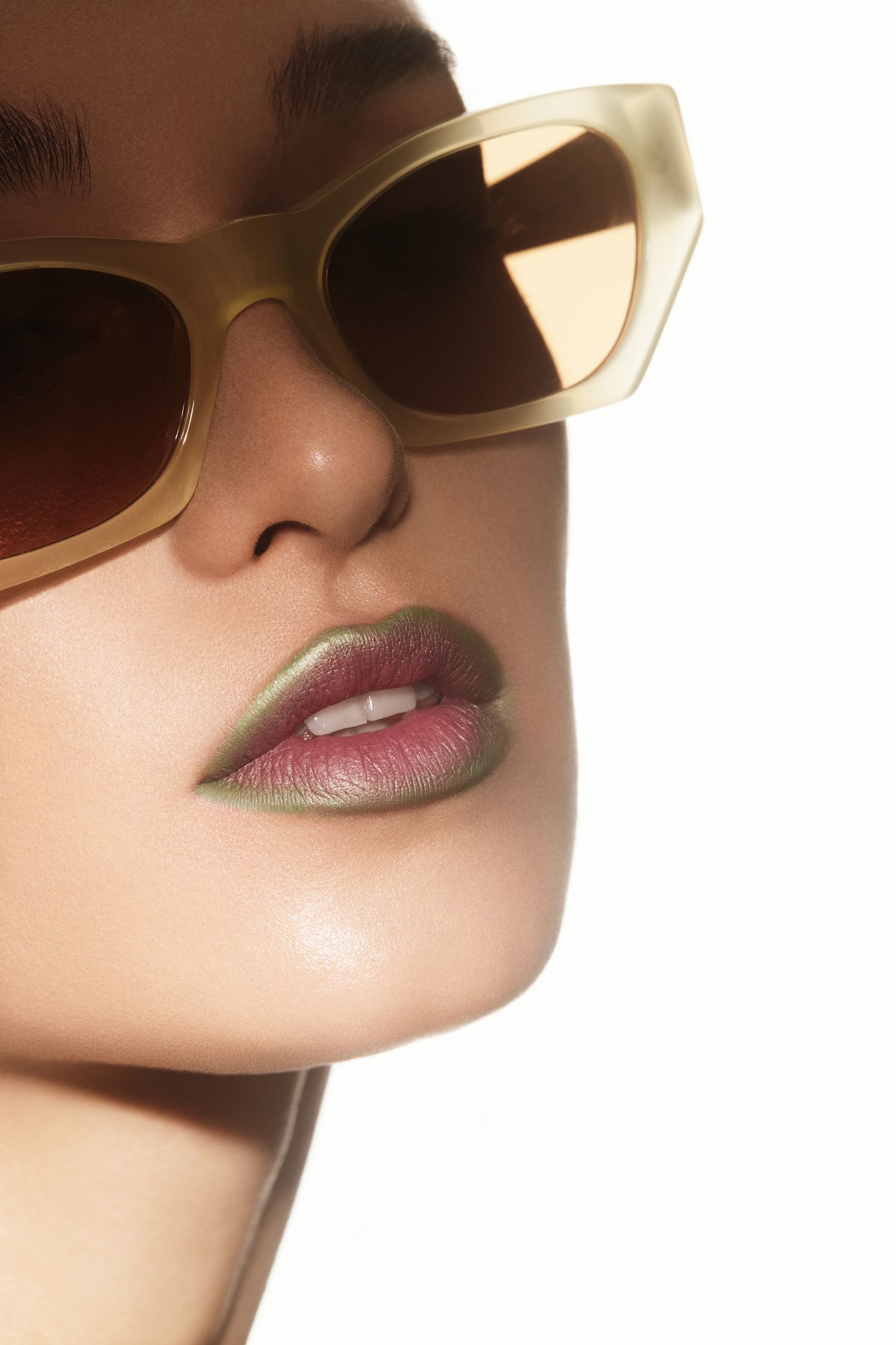 a woman wearing sunglasses and lipstick
