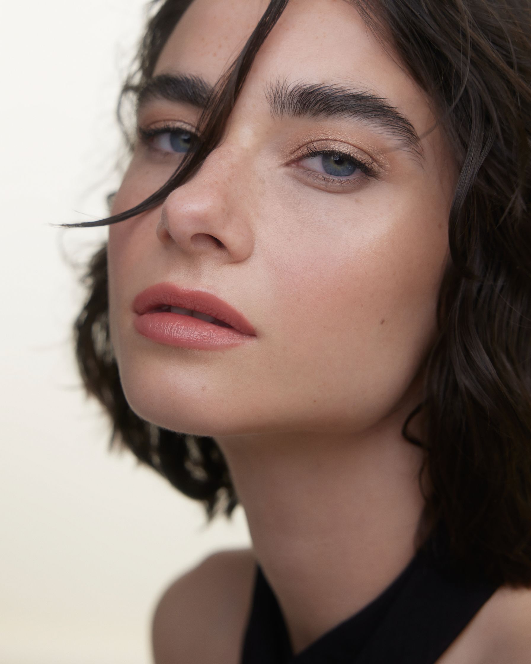 a woman with short hair is posing for a photo