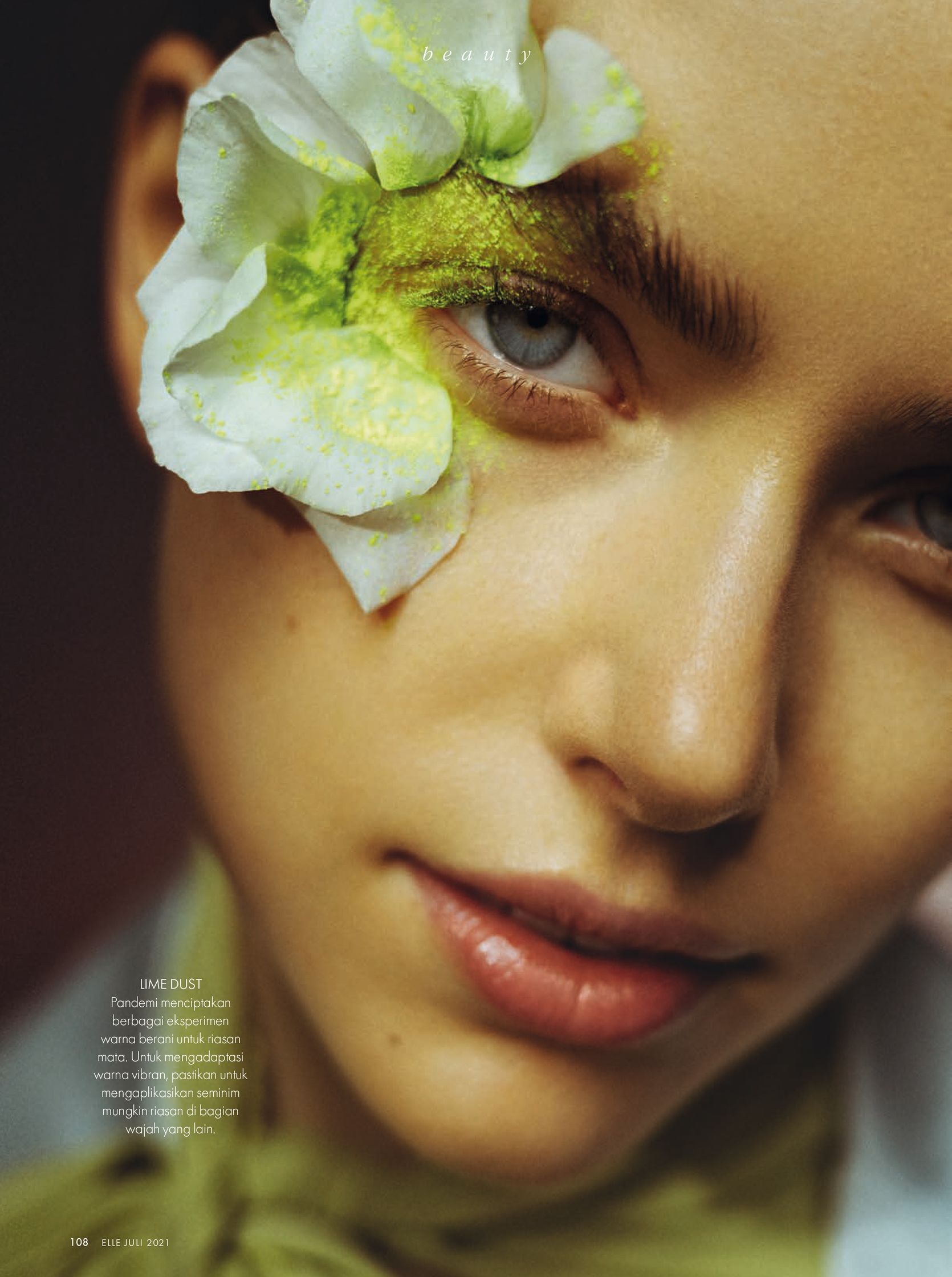 a woman with a flower on her face