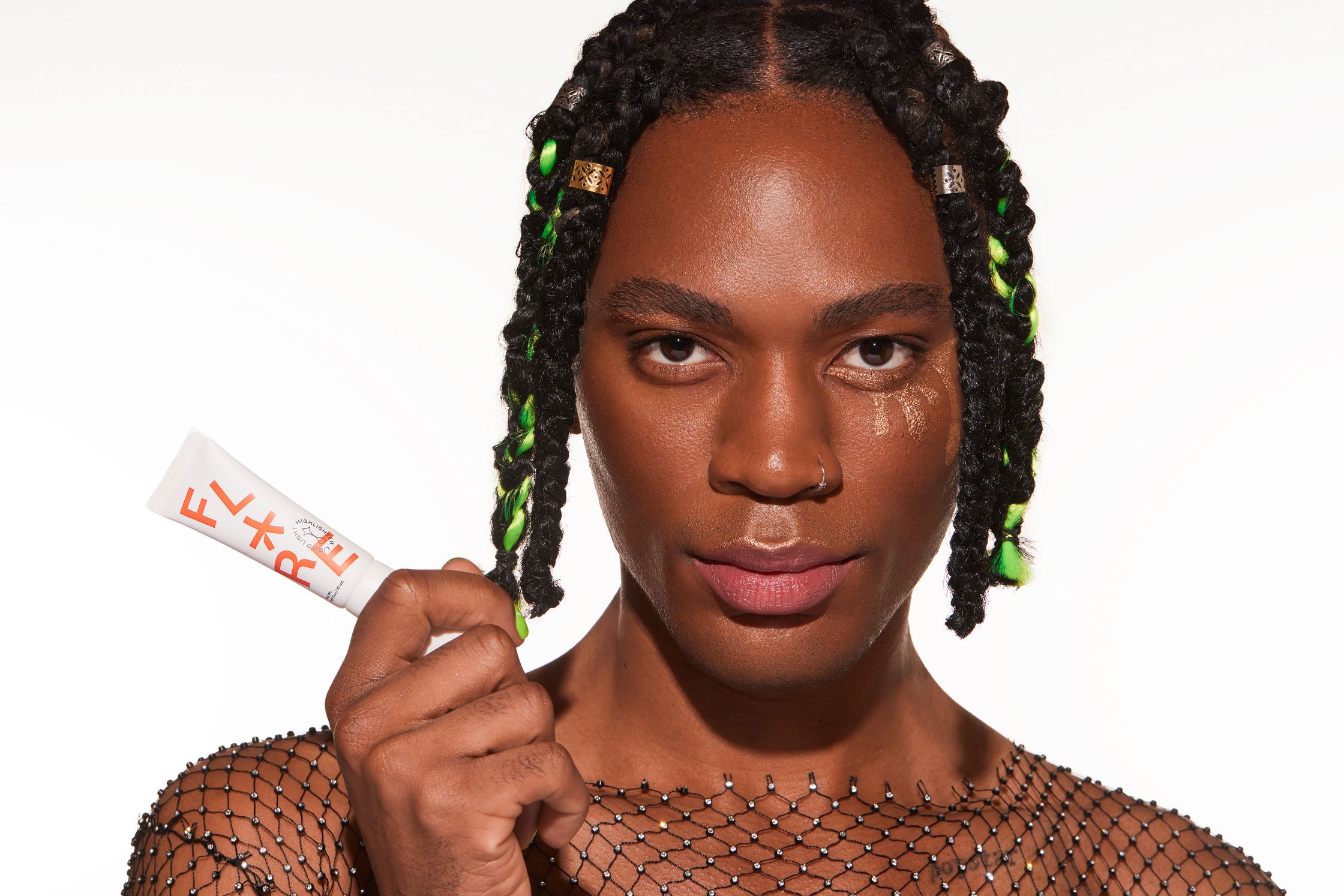 a black woman holding a piece of gum