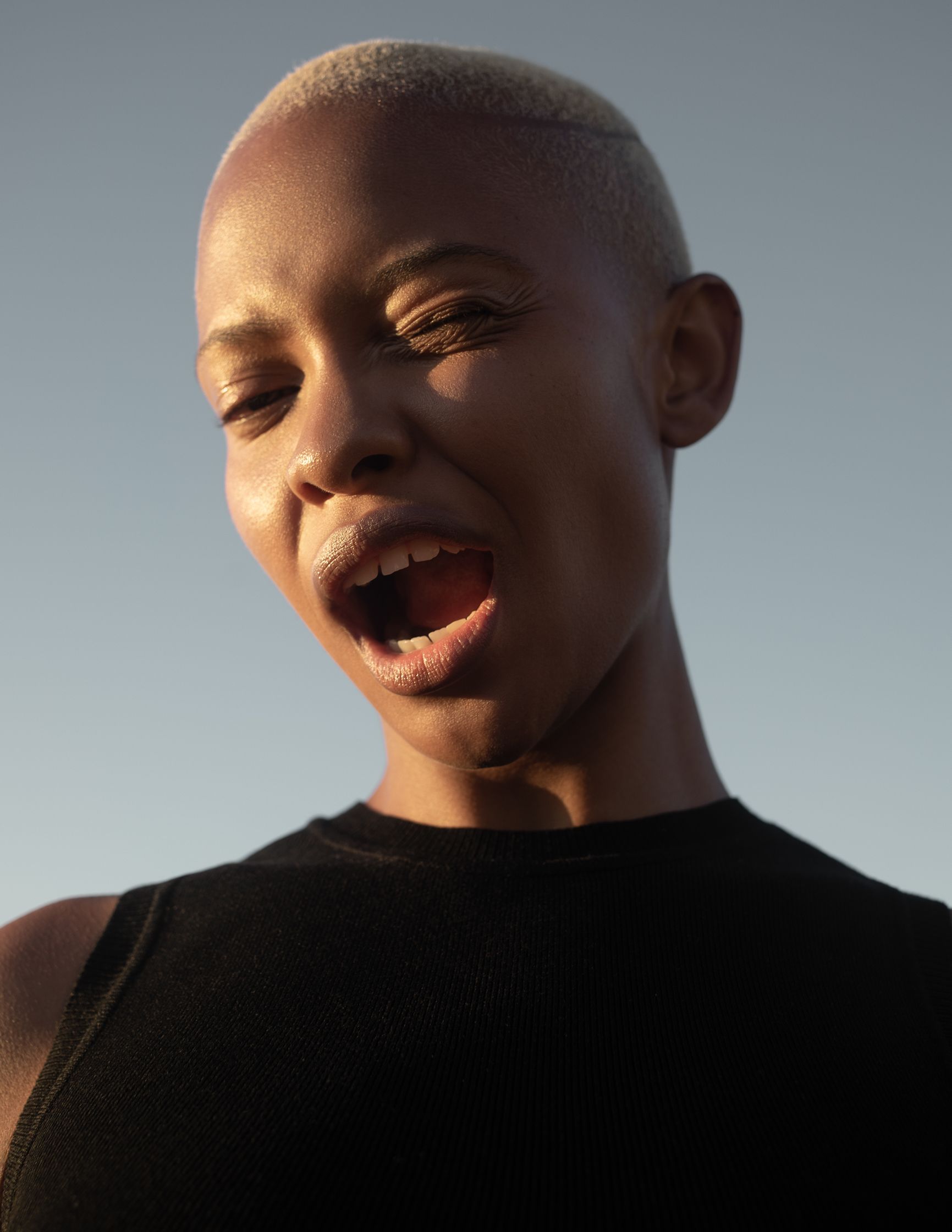 a black woman with blond hair with her mouth open