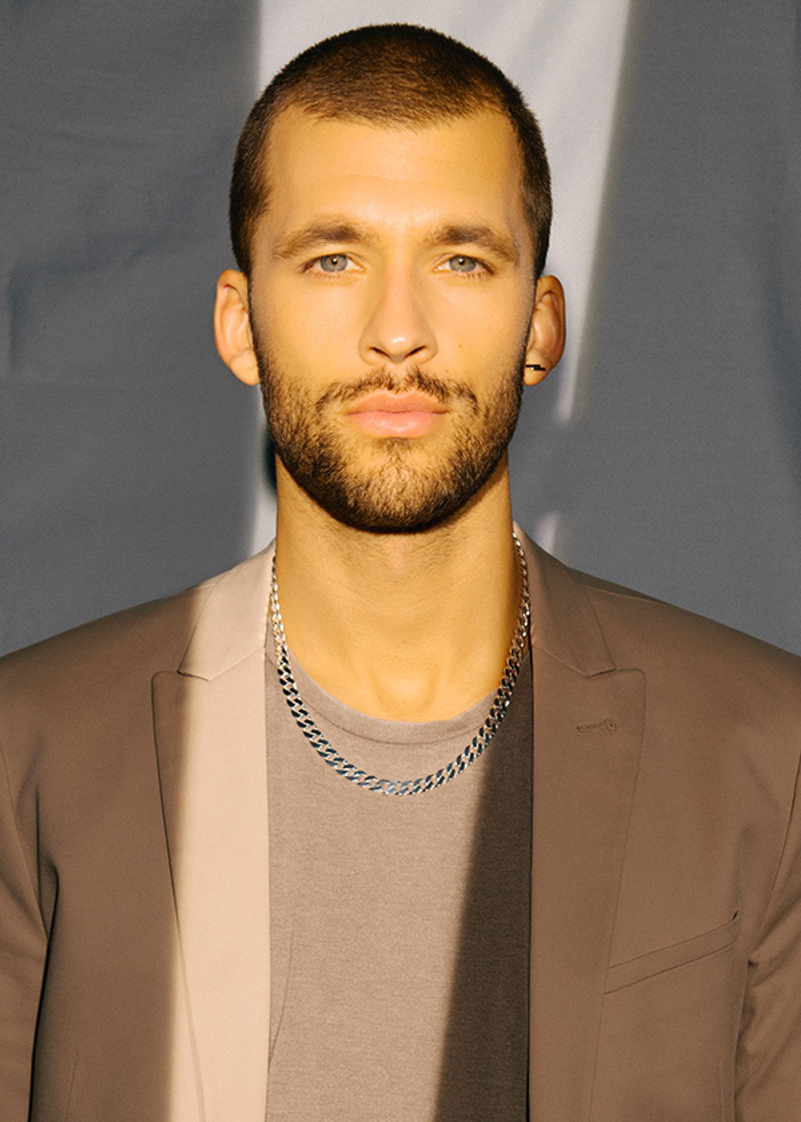 a man with a beard is posing for a picture