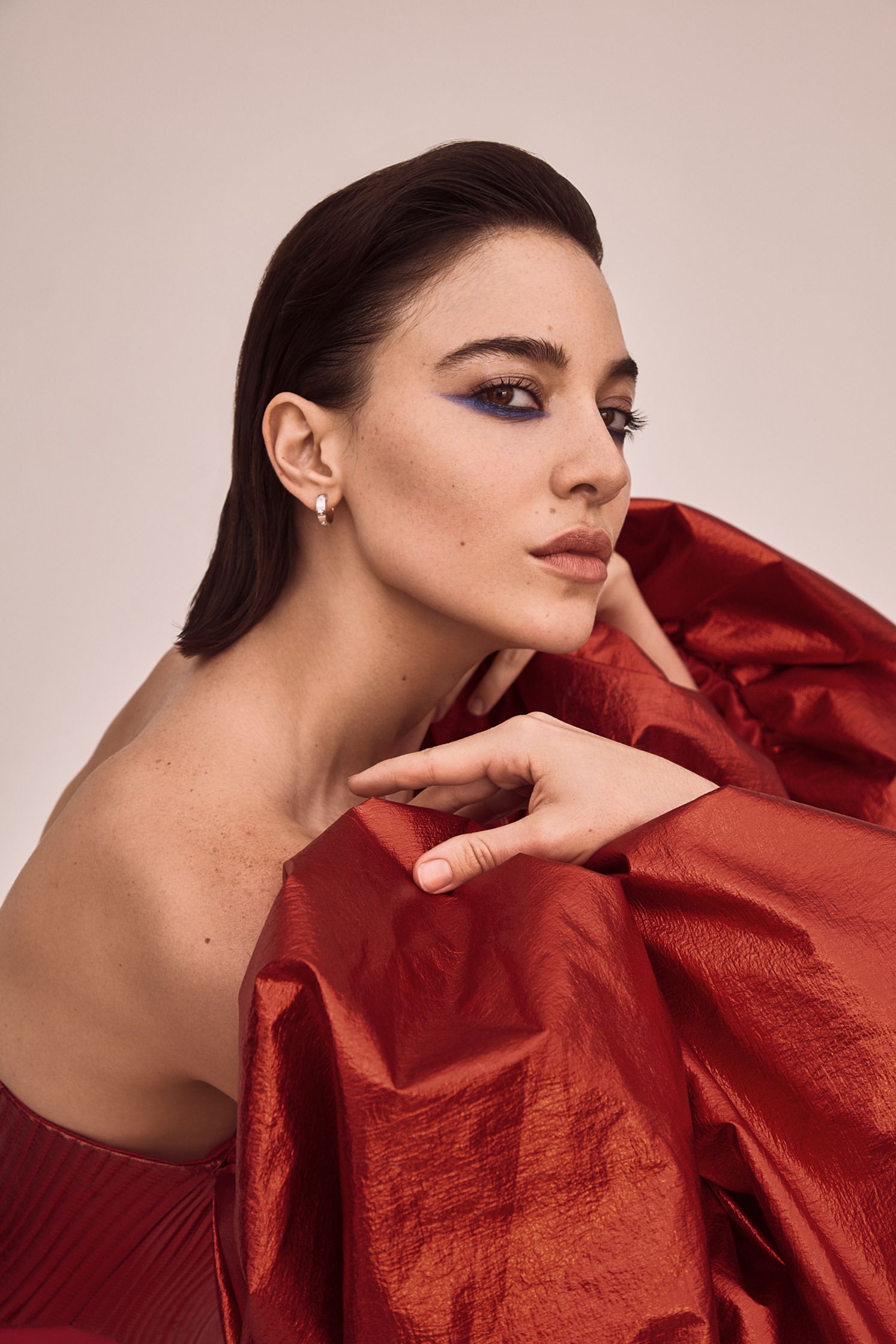 a woman in a red dress posing