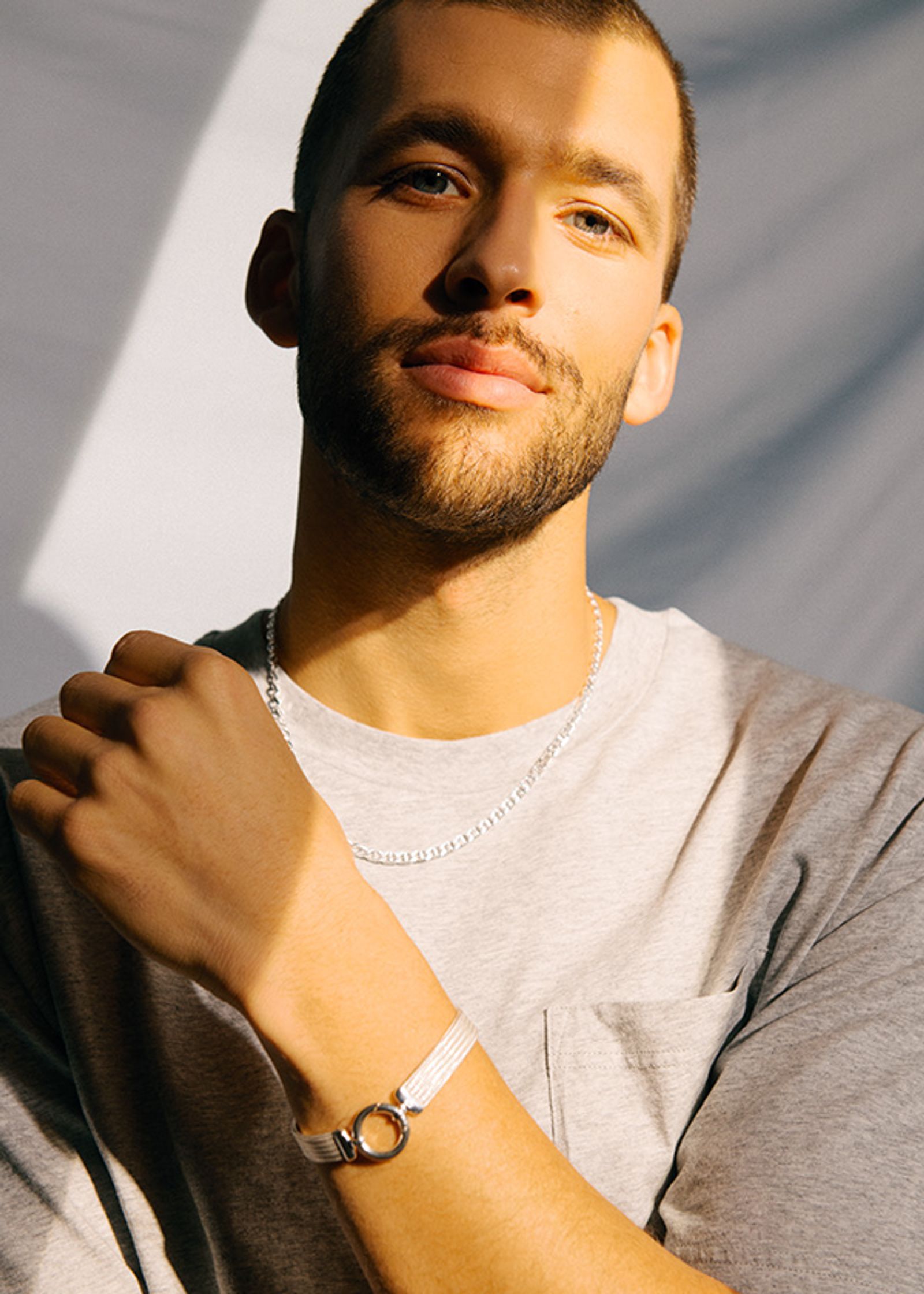 a man with a beard is posing for a photo