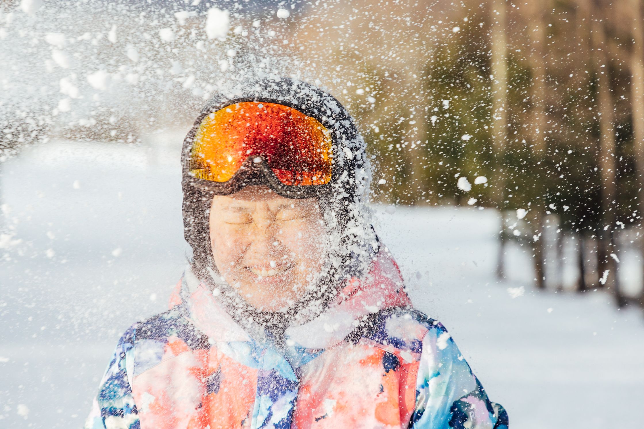 a child wearing ski goggles in the snow
