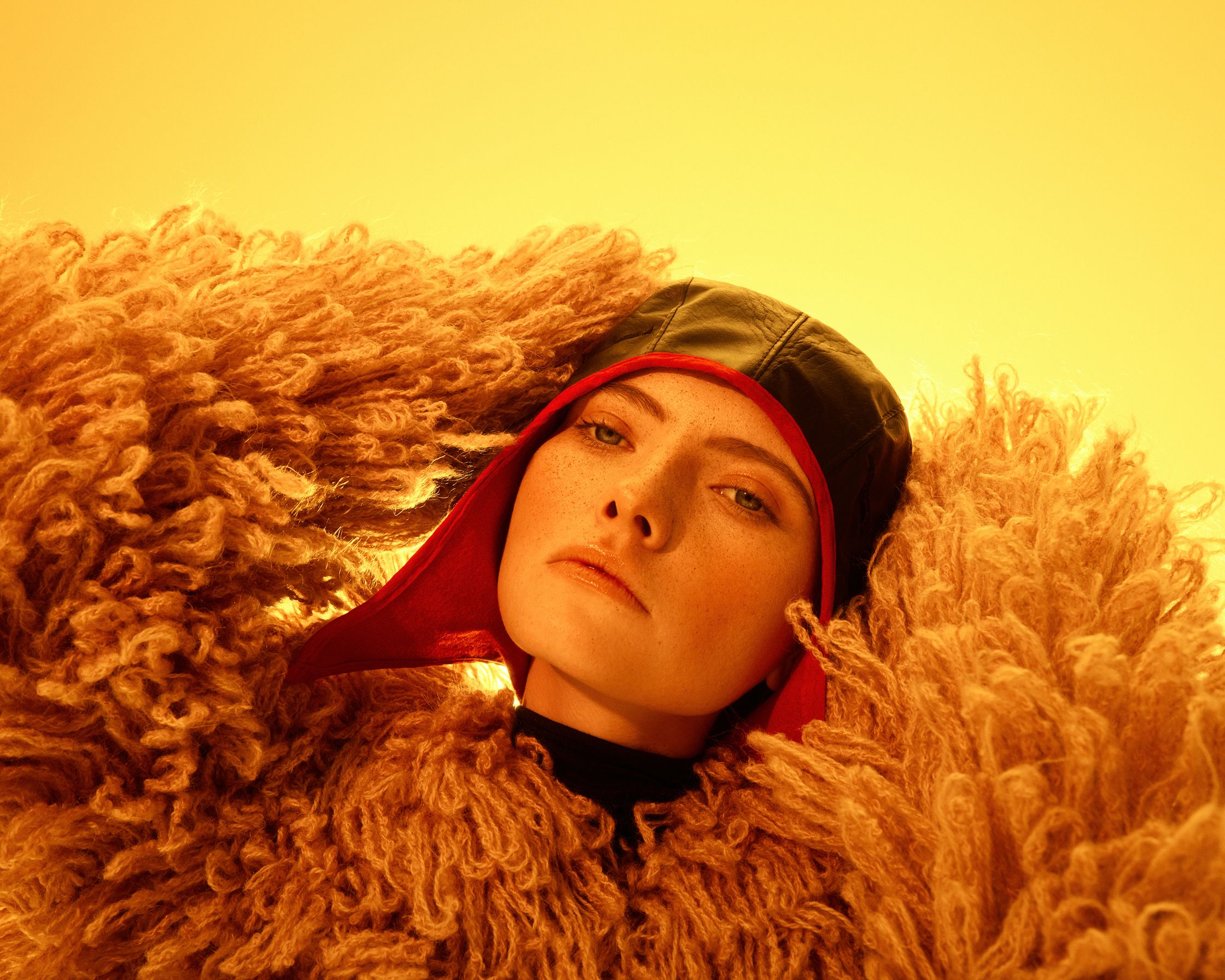 a woman wearing a fur coat and hat