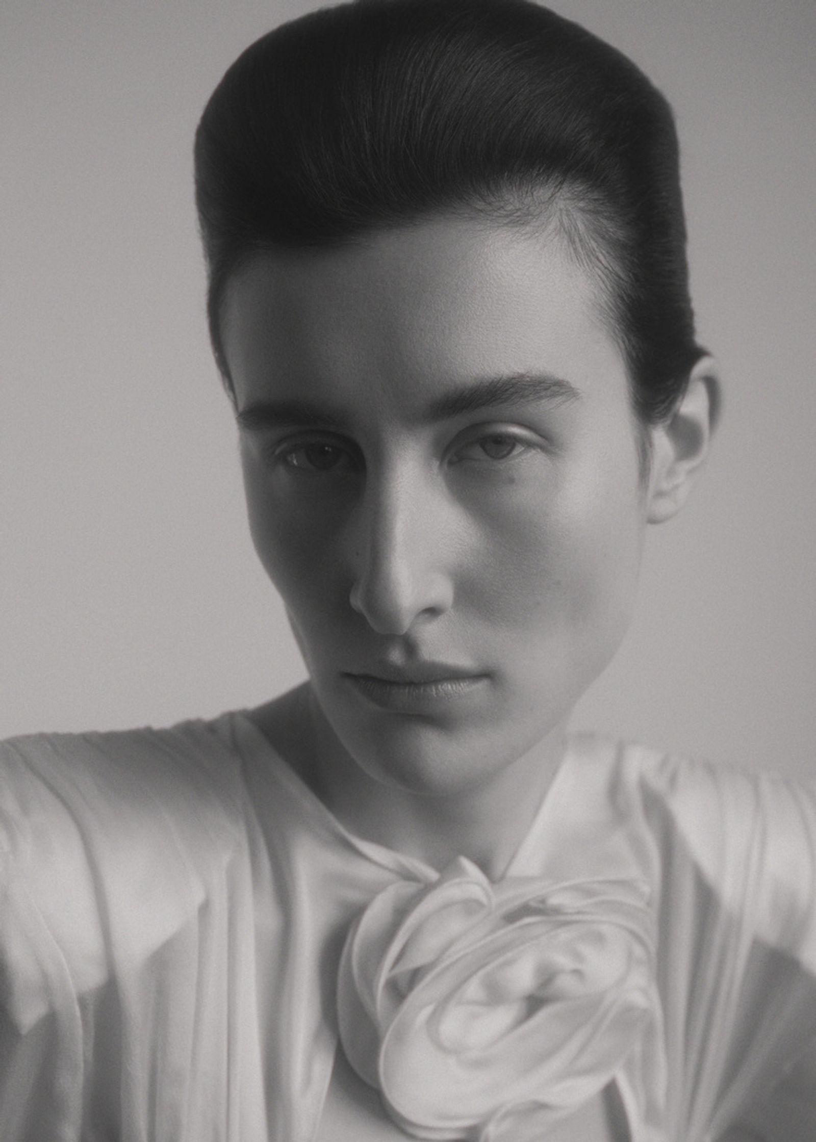 a black and white photo of a woman posing
