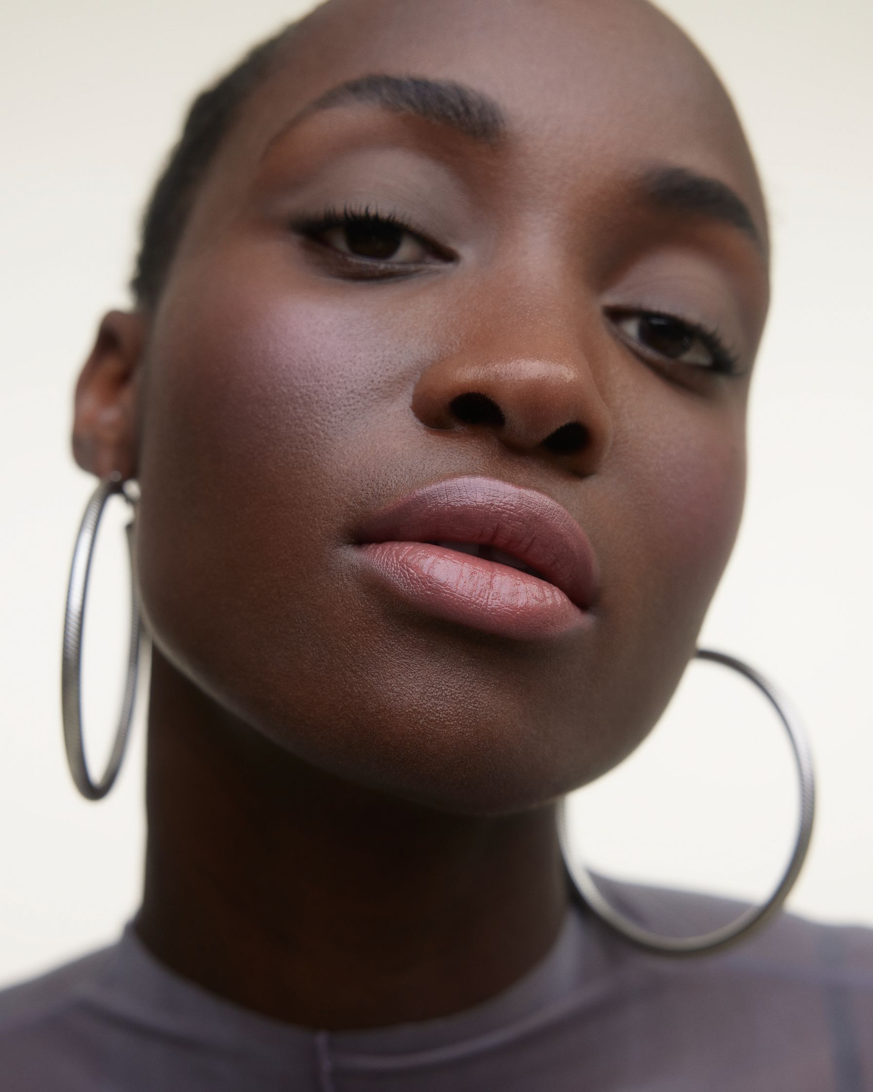 a black woman with large hoop earrings