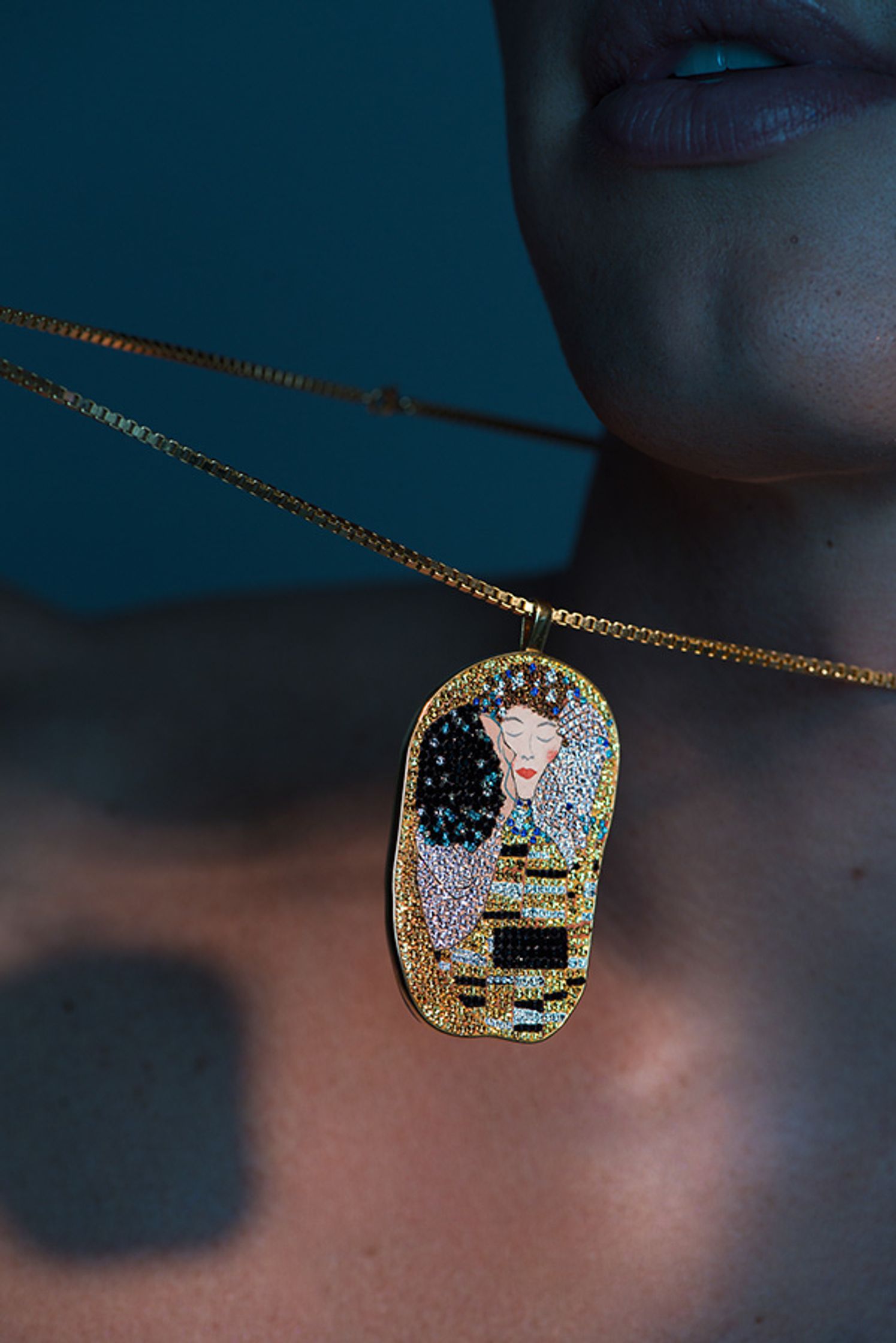 a woman wearing a necklace with an image of a woman