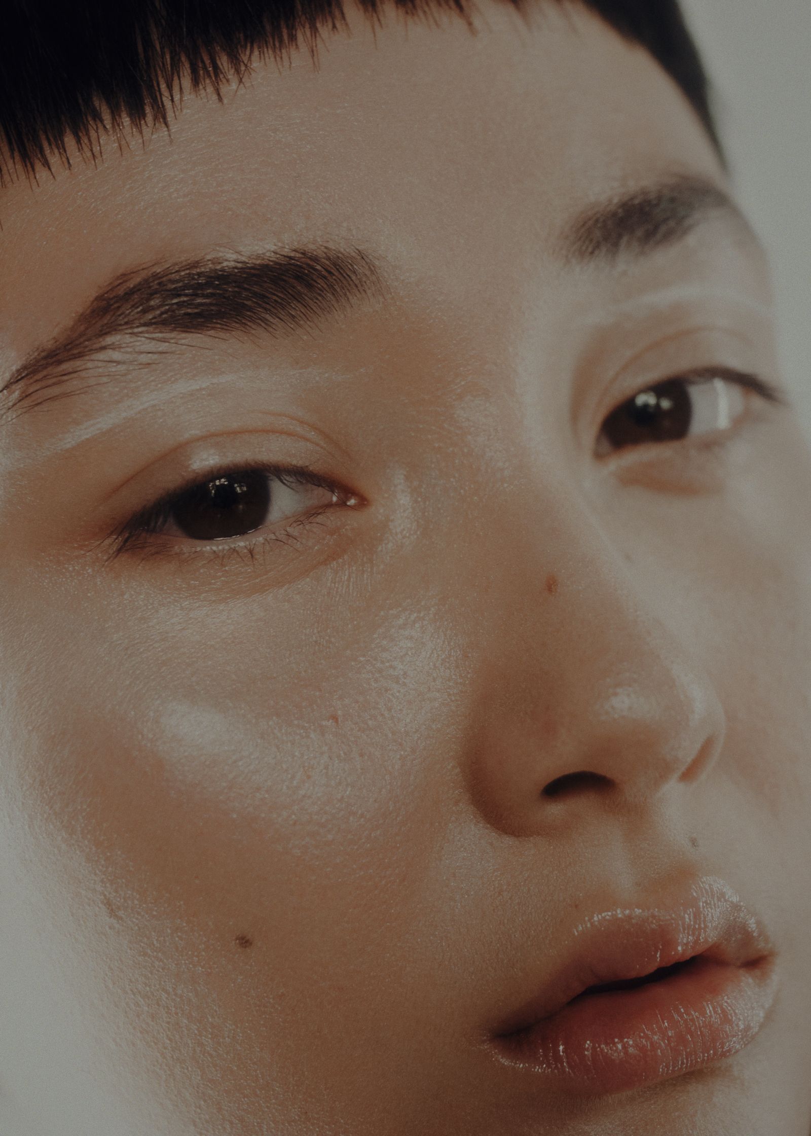 a close up of a woman with short hair