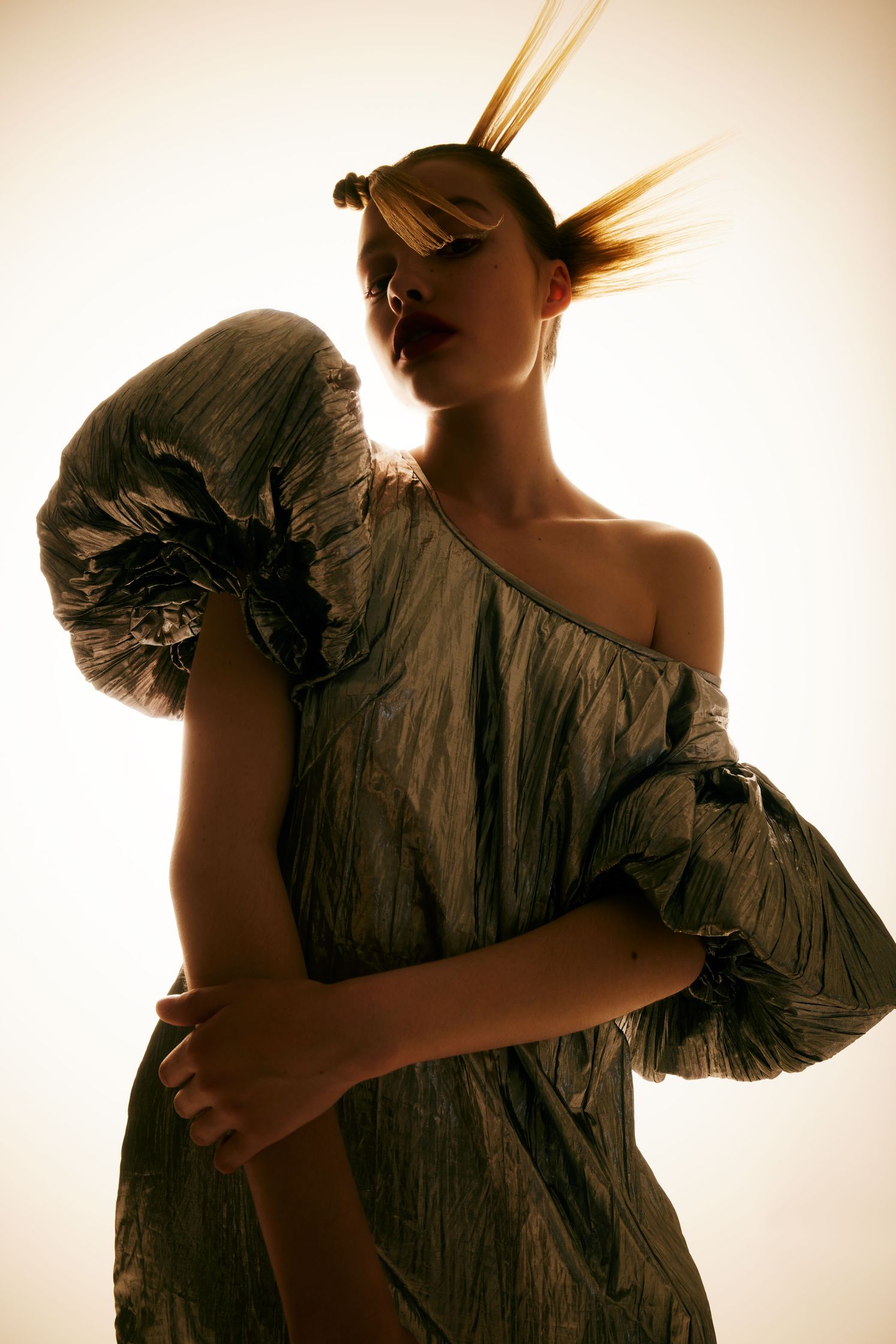 a woman in a silver dress