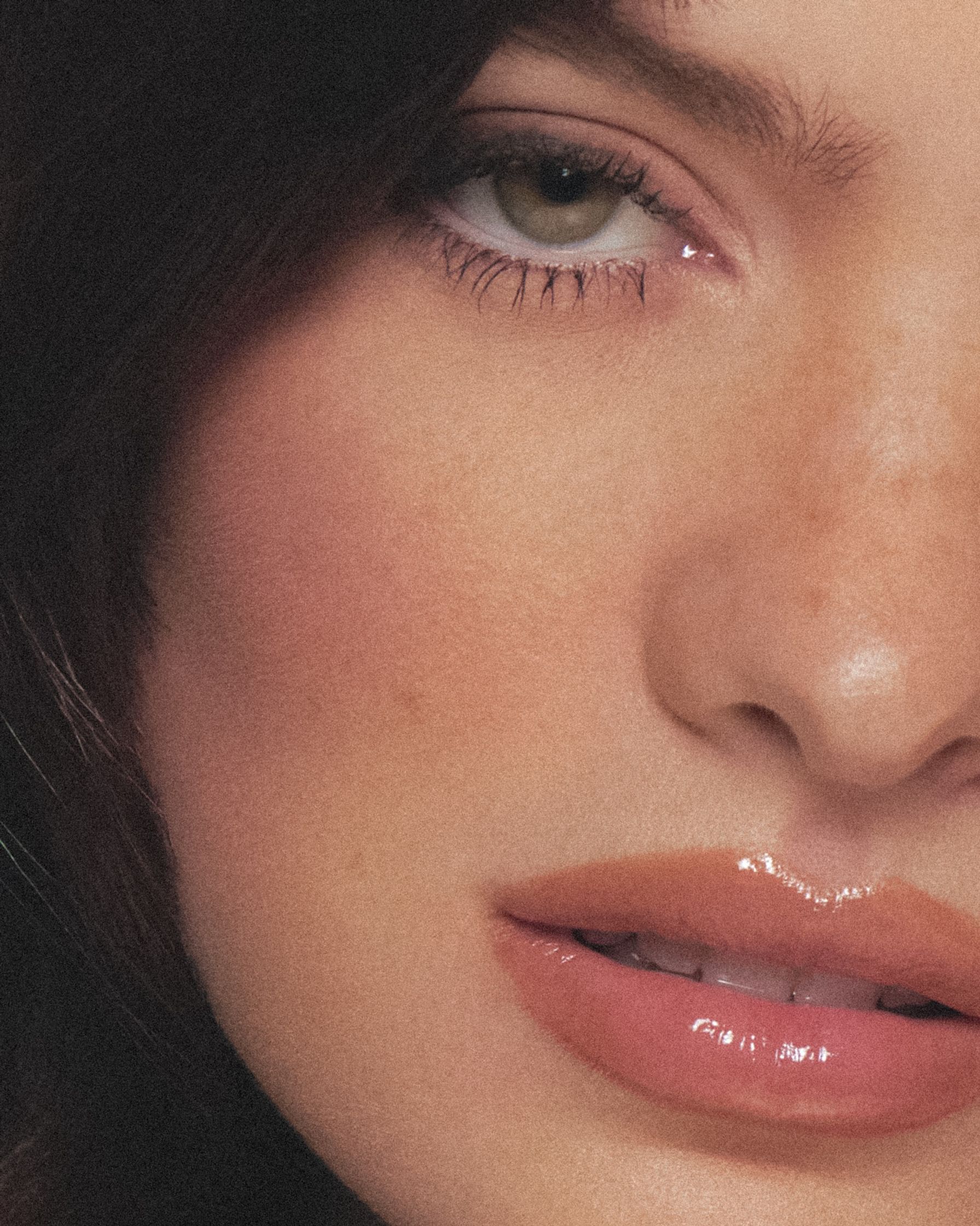 a close up of a woman with brown eyes