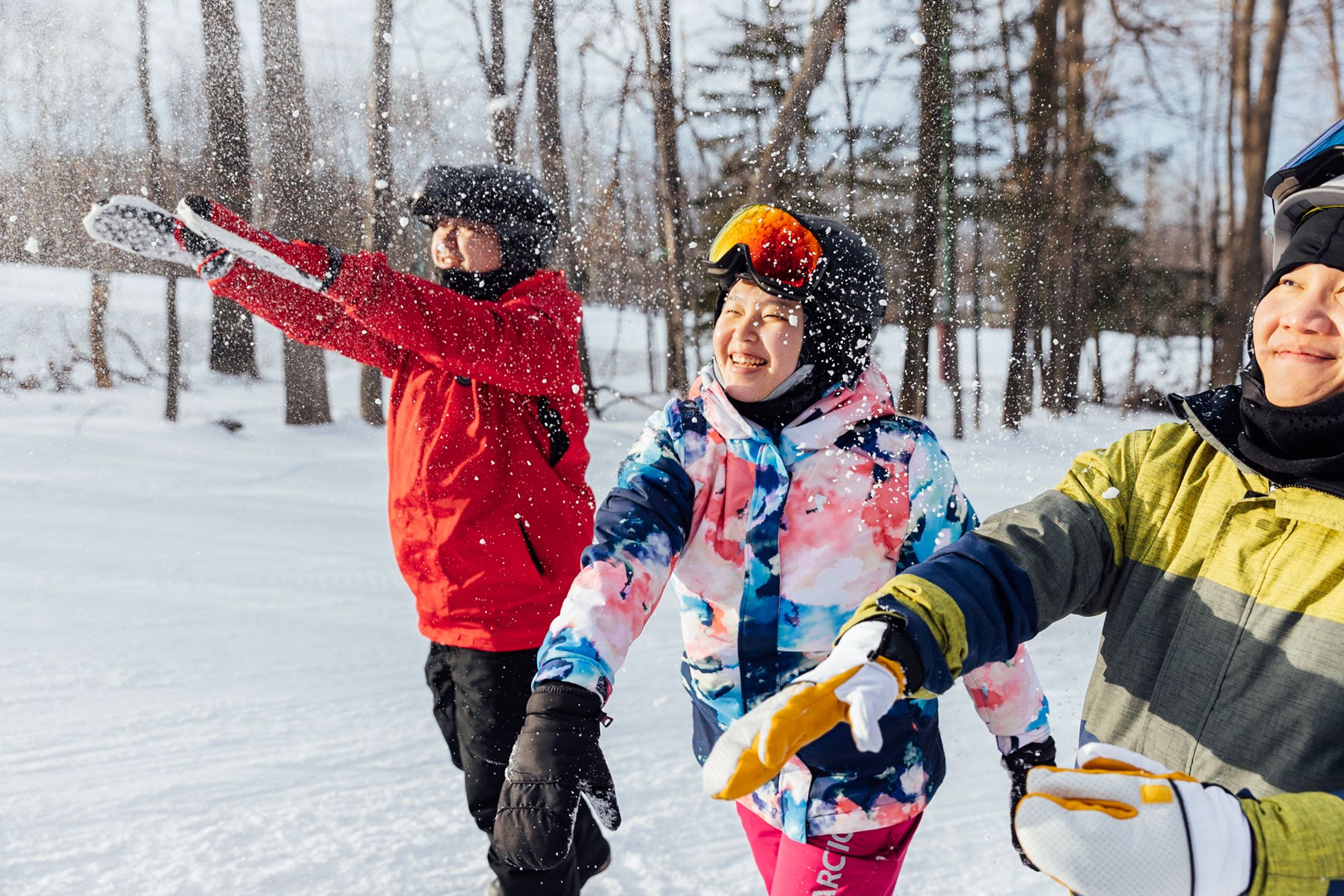 a group of people wearing ski gear on a snowy slope