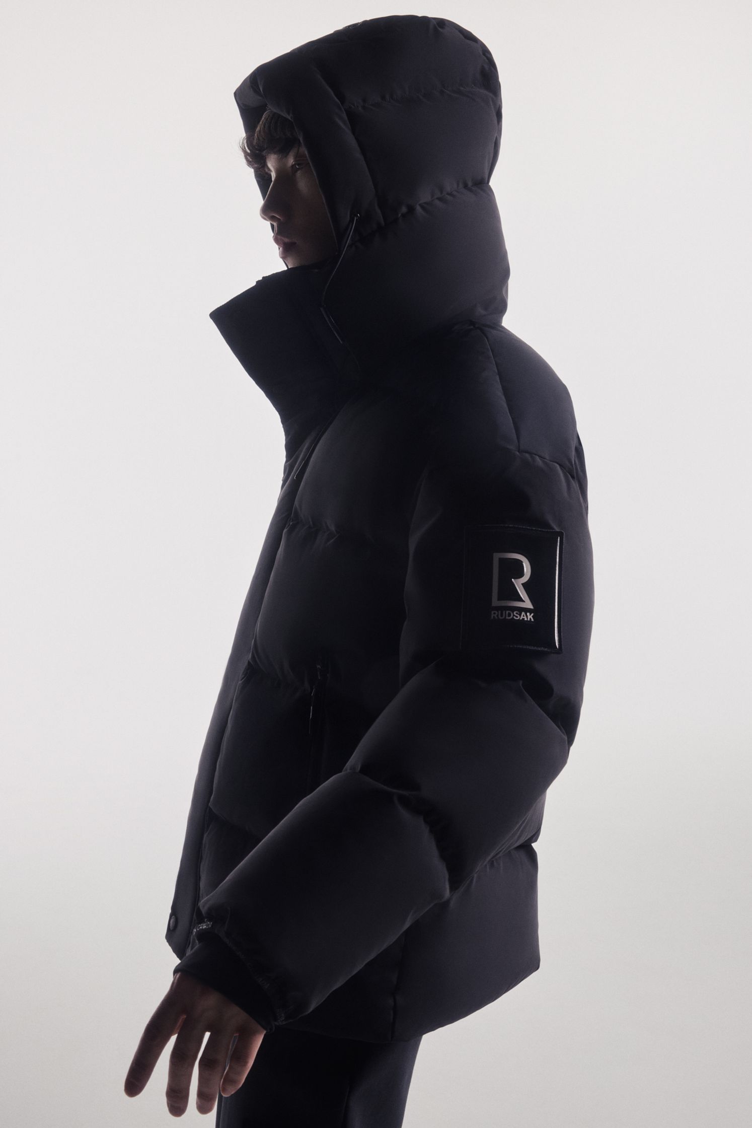 a man wearing a black puffer jacket