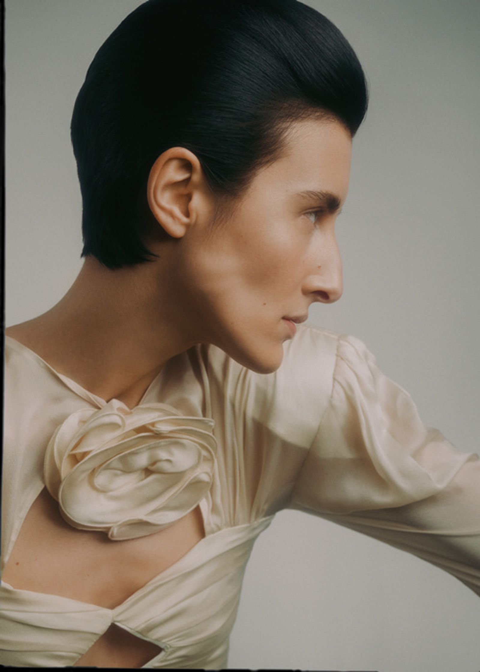 a woman in a white dress with black hair