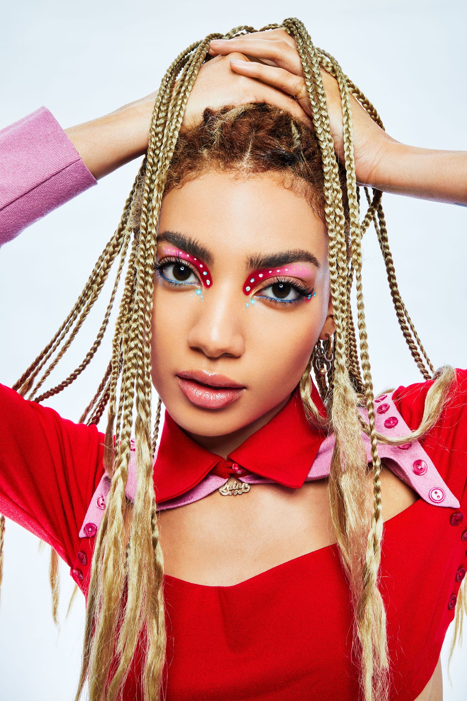 a woman with dreadlocks posing for a photo